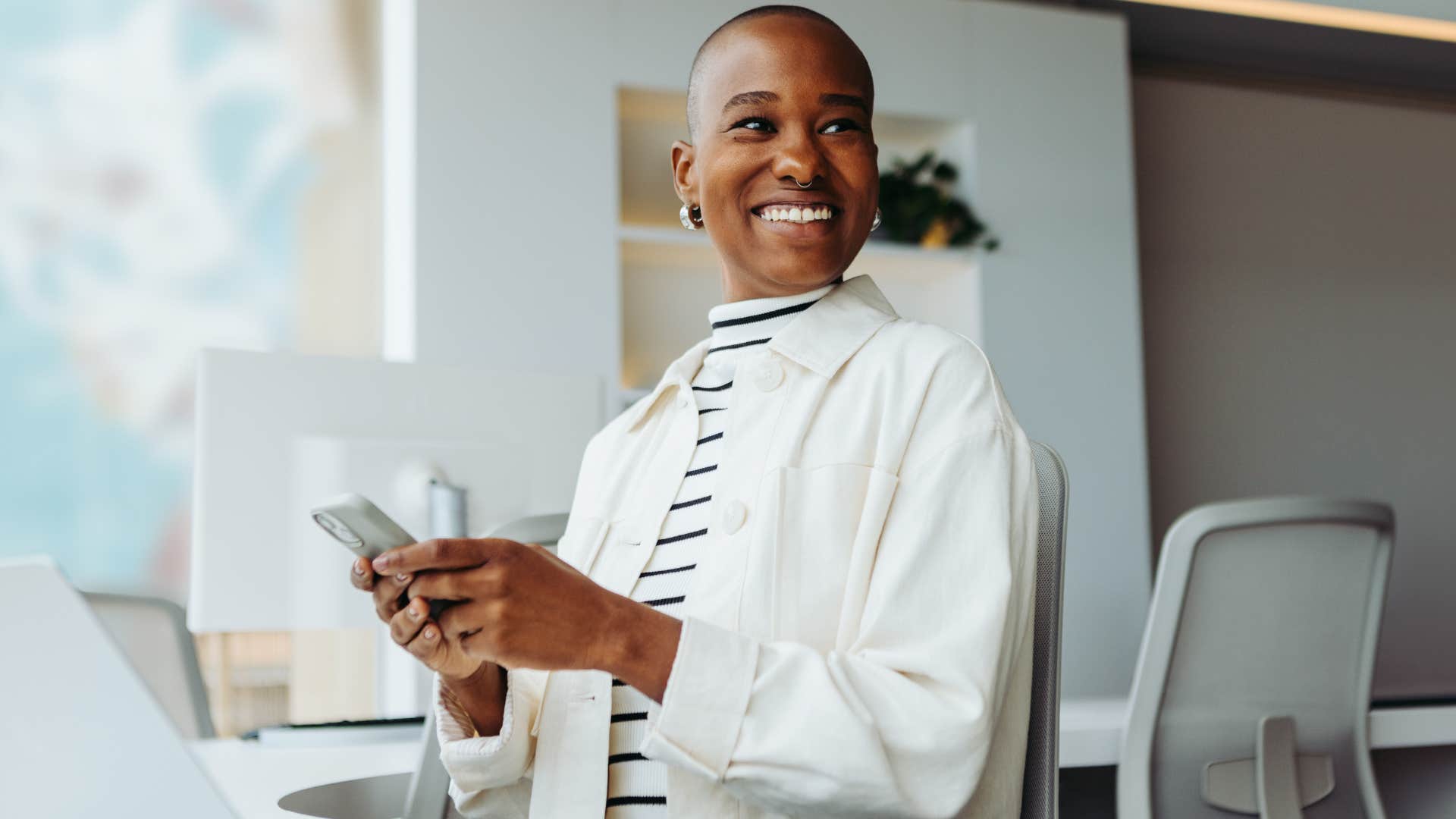 Woman smiling at her work desk