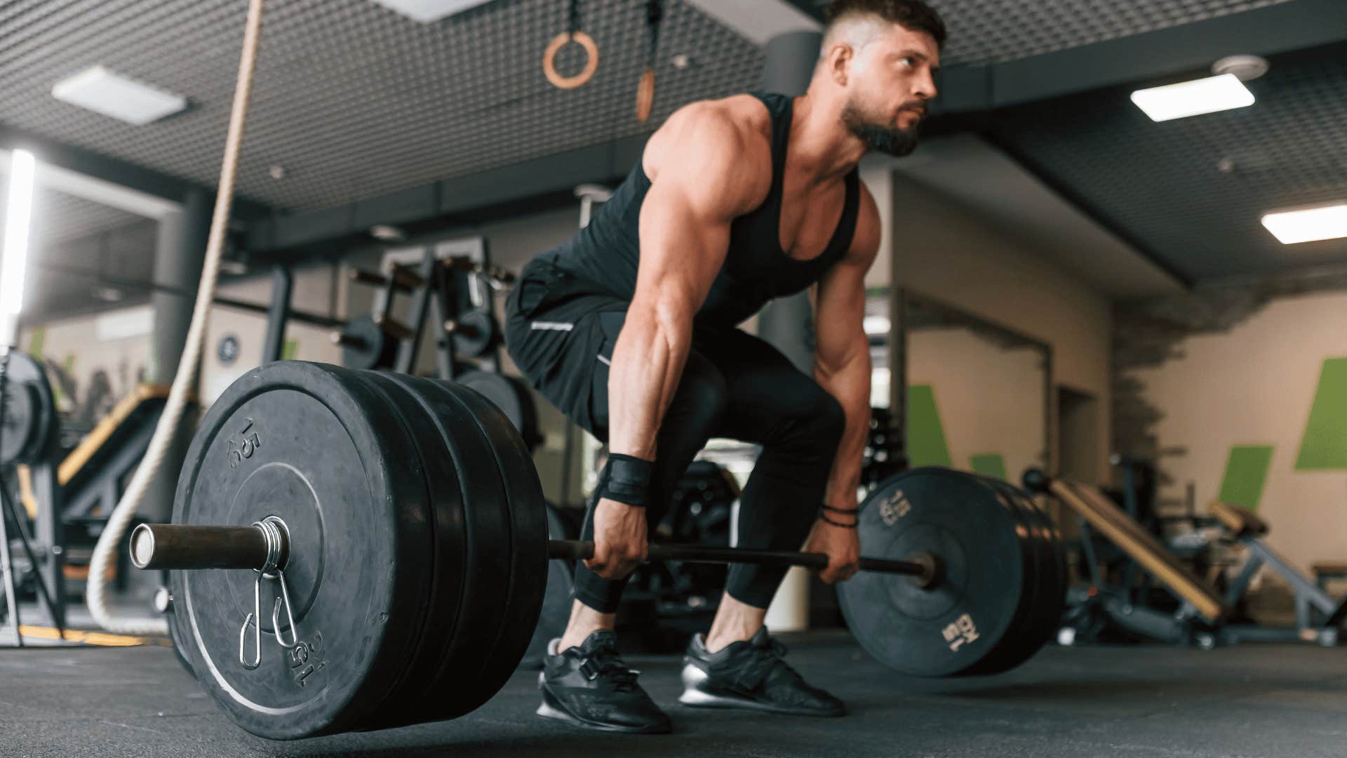 man lifting weights