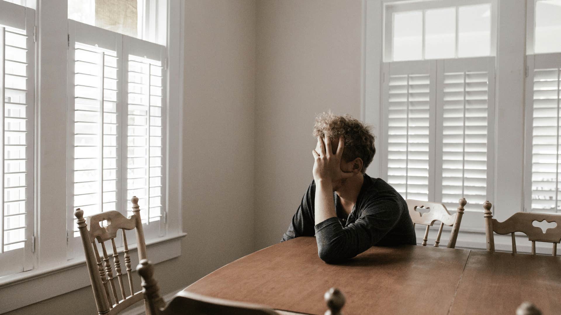 man upset at table