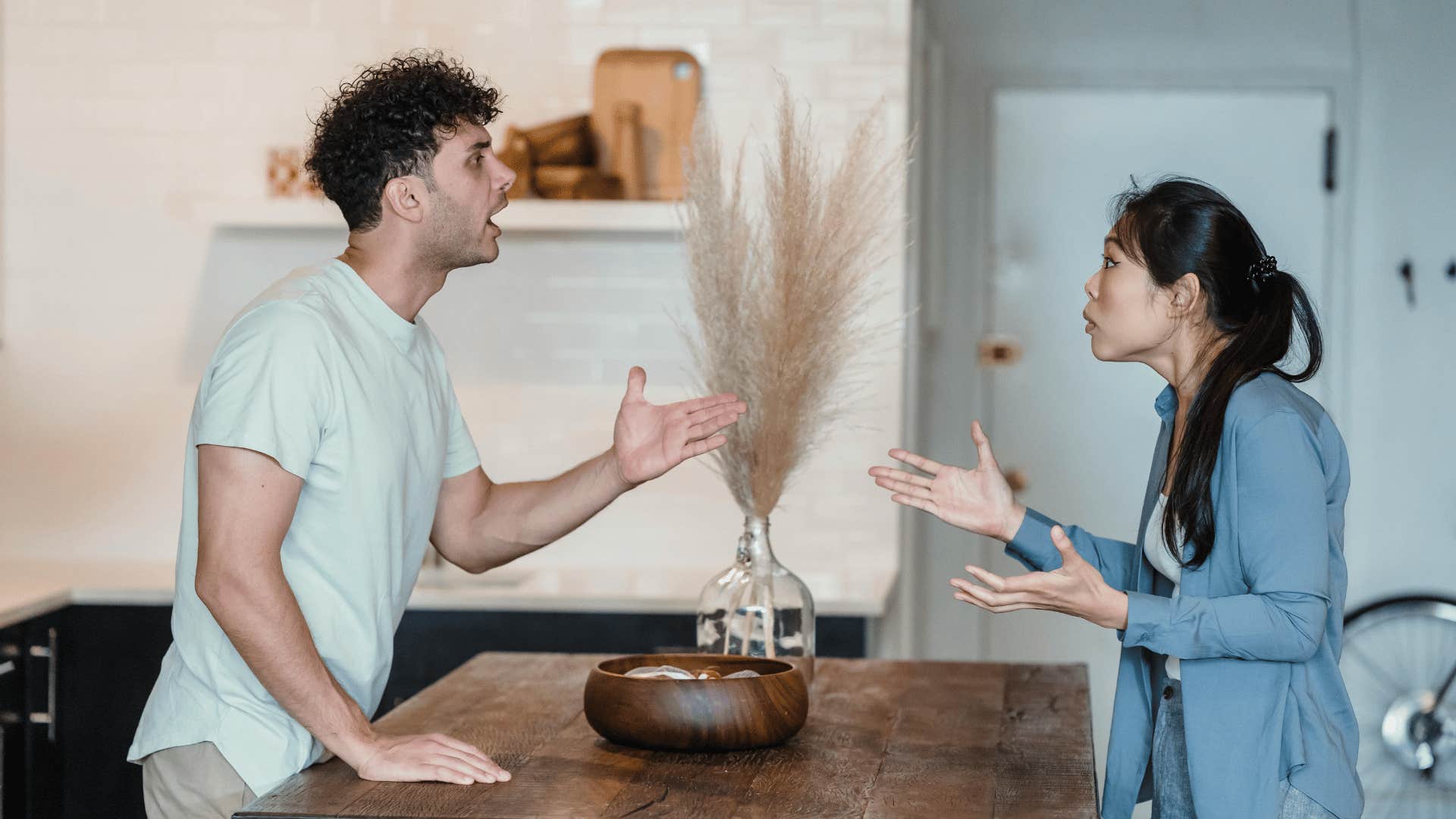 couple arguing in kitchen