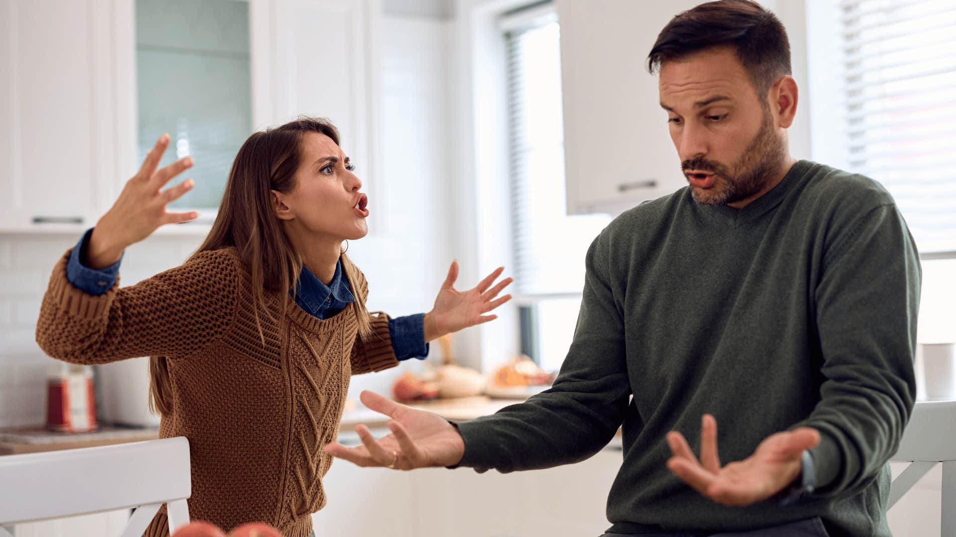 couple arguing in kitchen