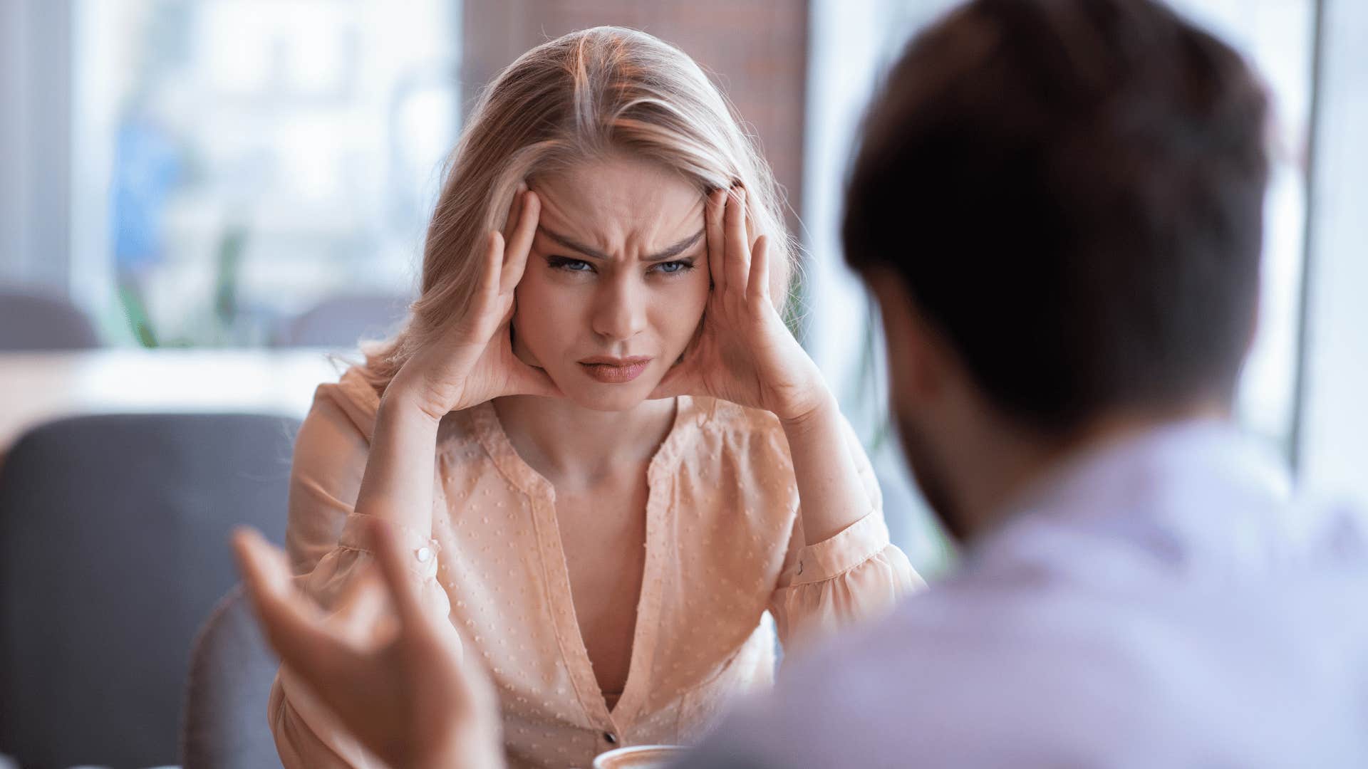 woman upset at man on date