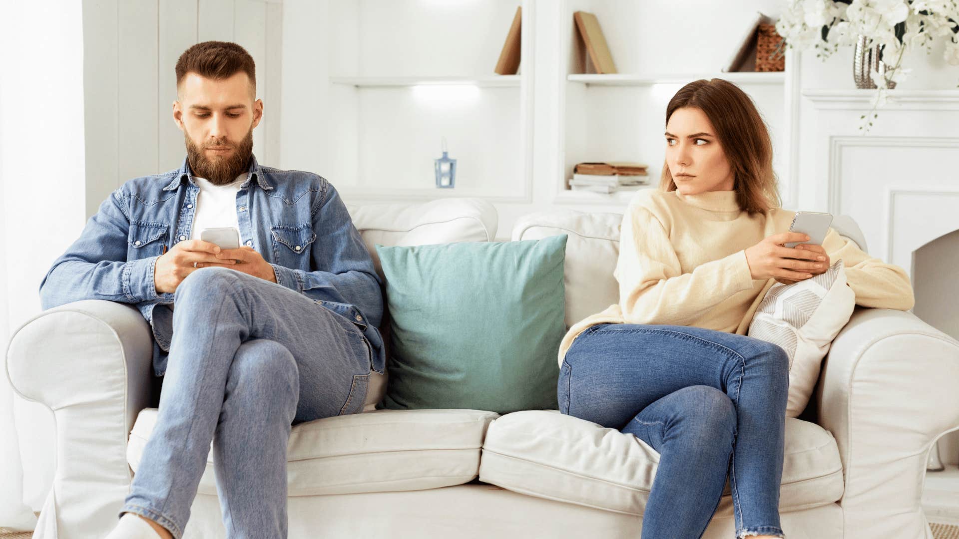 couple sitting on couch not talking