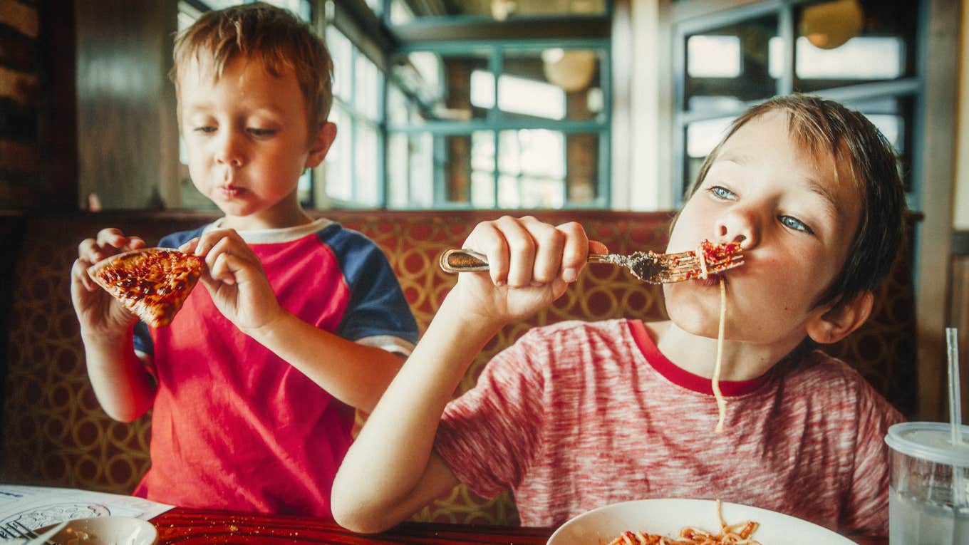 American children eating unhealthy meals at a restaurant