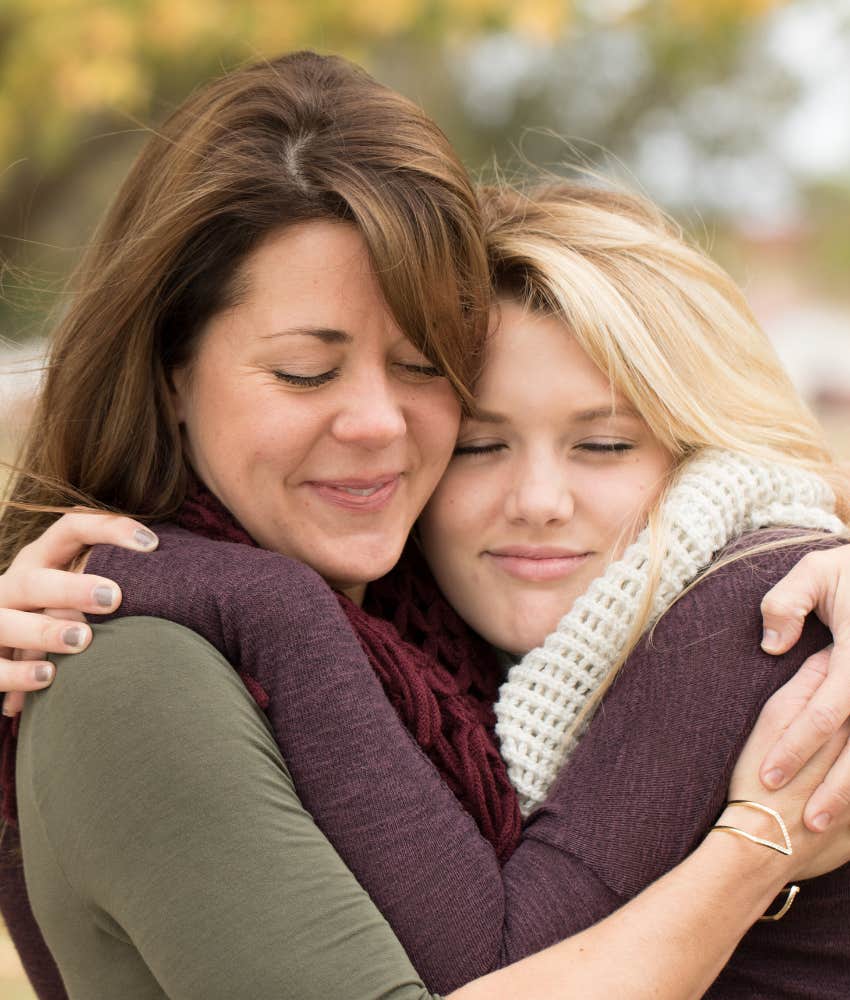 a hug of forgiveness between female friends