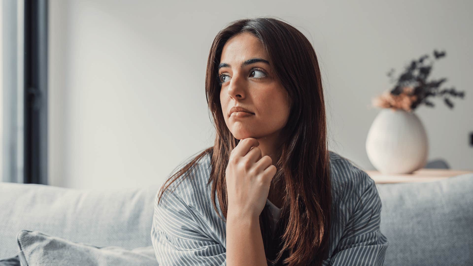 woman alone on couch