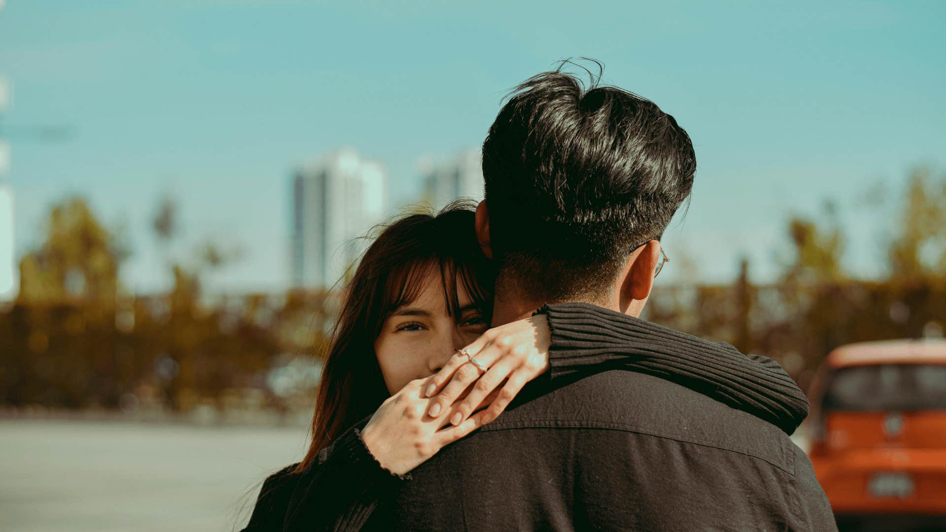 man and woman hugging