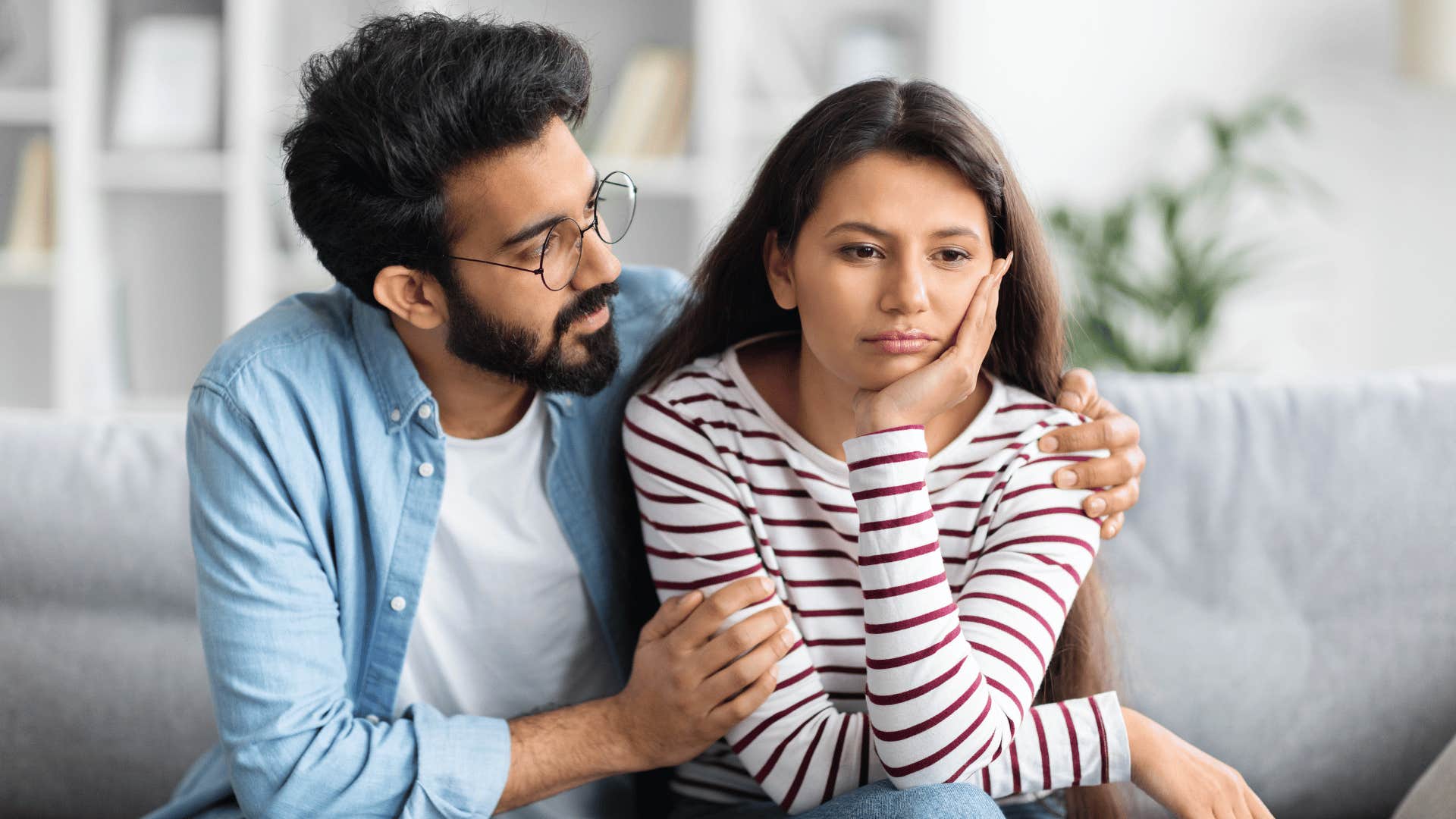 man trying to talk to woman while woman ignores him