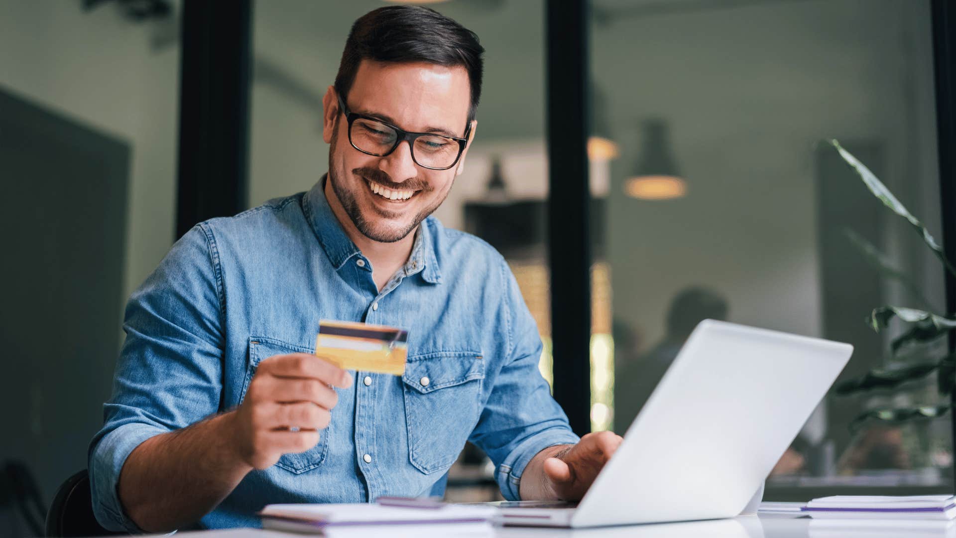 man using card and spending money