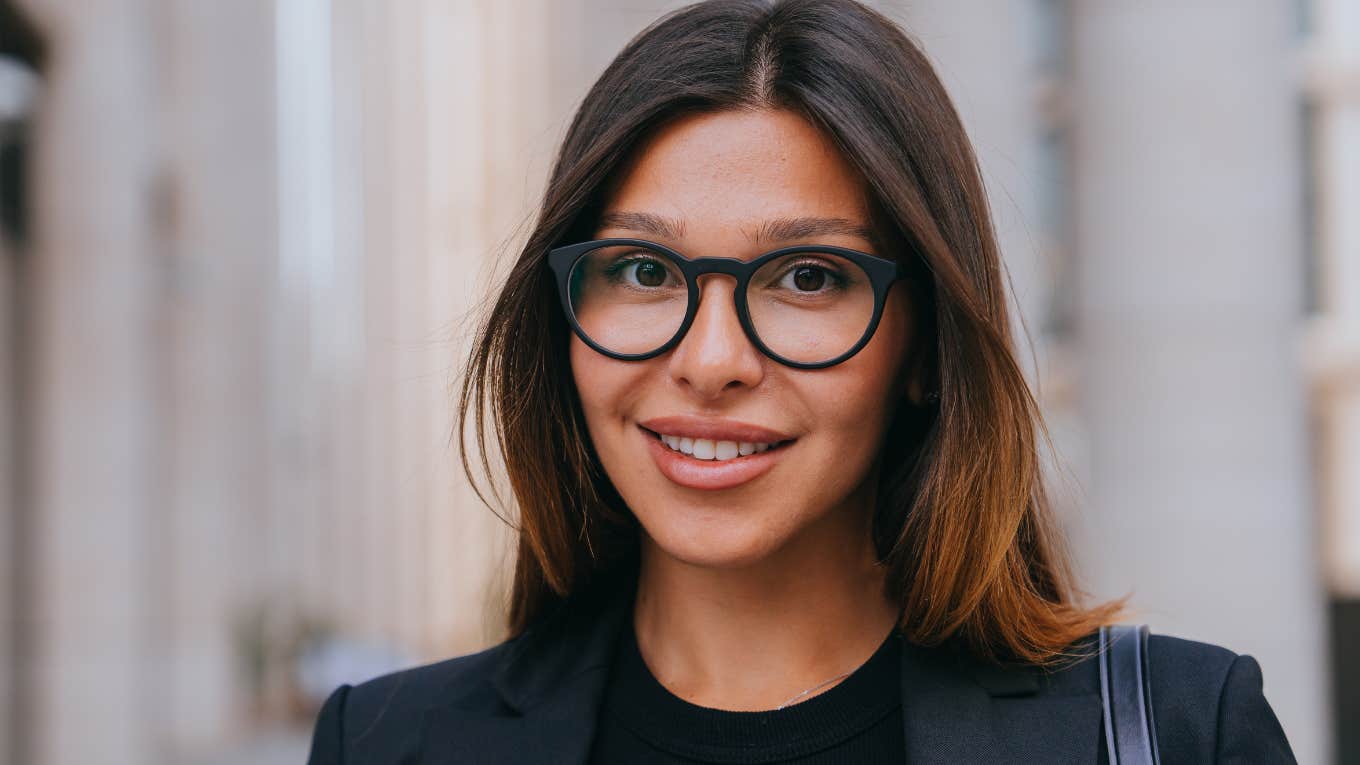 smiling happy businesswoman wearing black