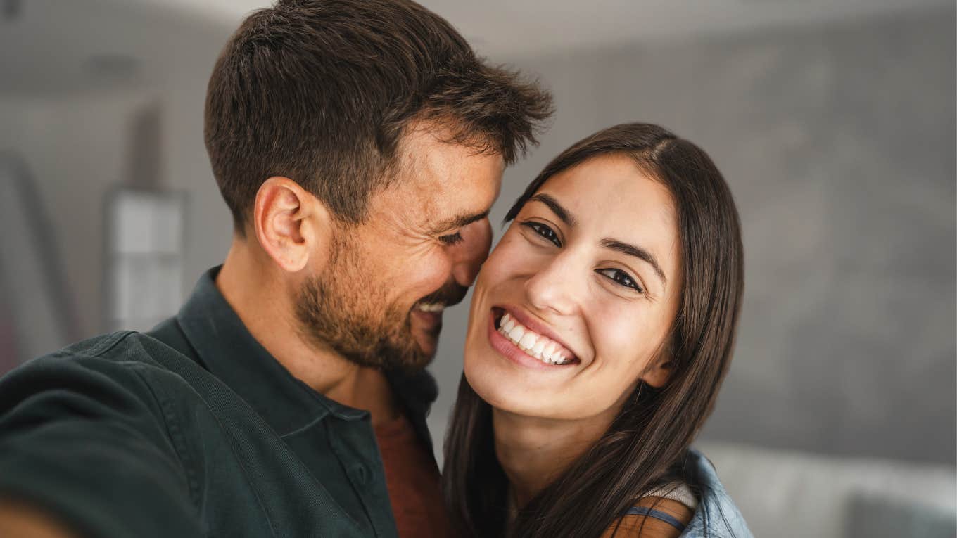 Happy couple smiling and hugging