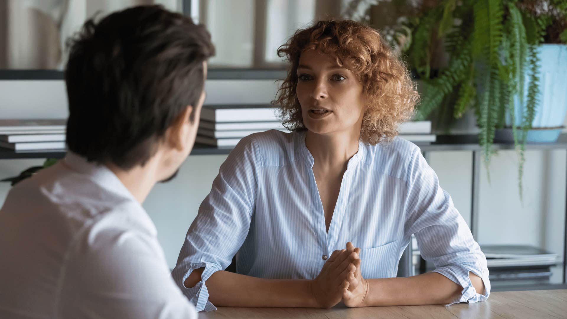 woman talking to coworker 