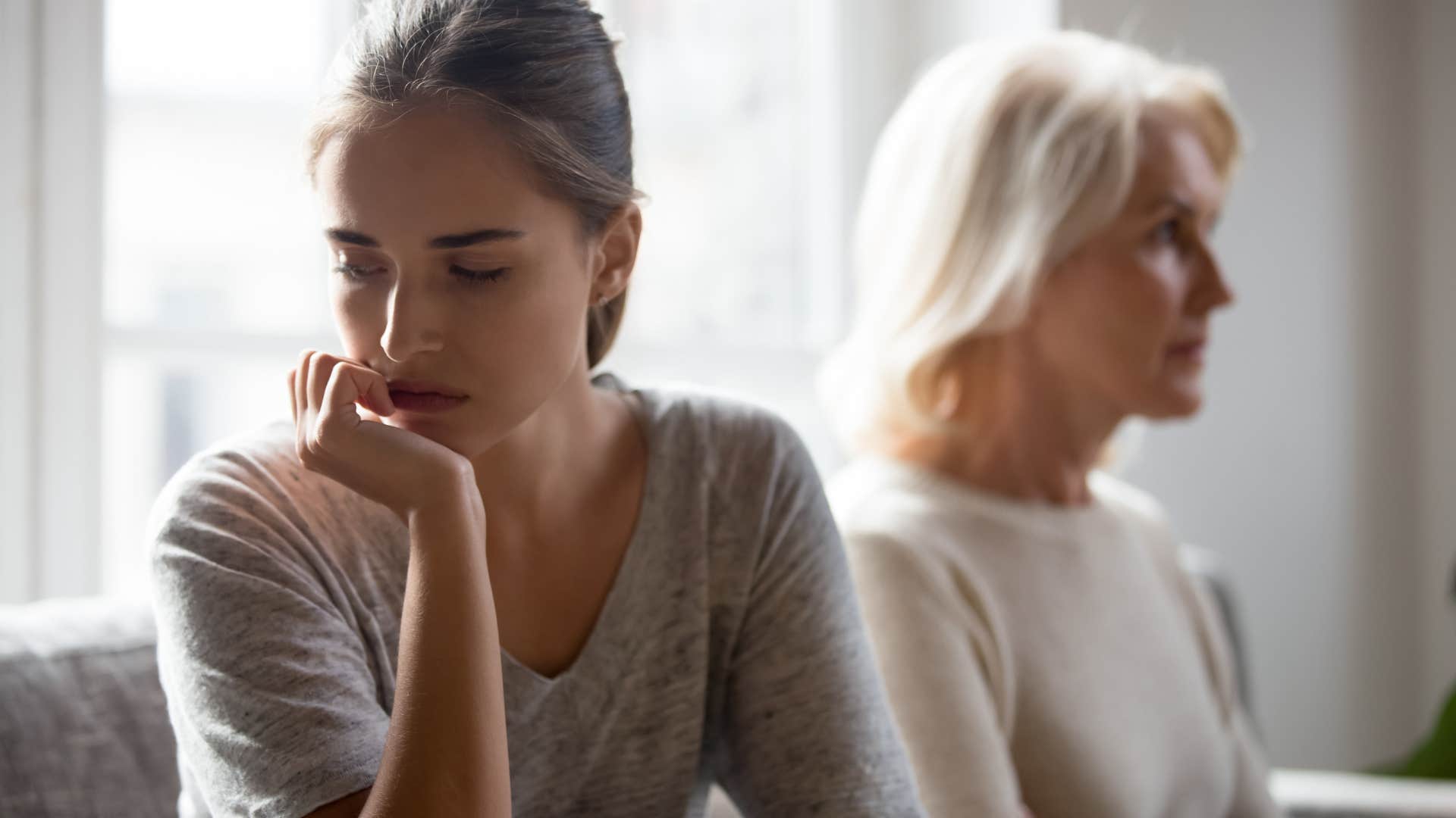 Woman turned away from her upset mother.