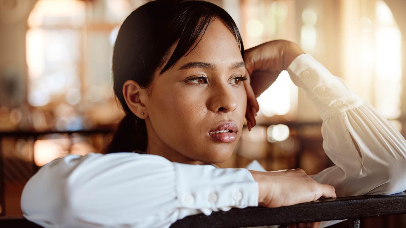 Tired woman resting her head in her hands