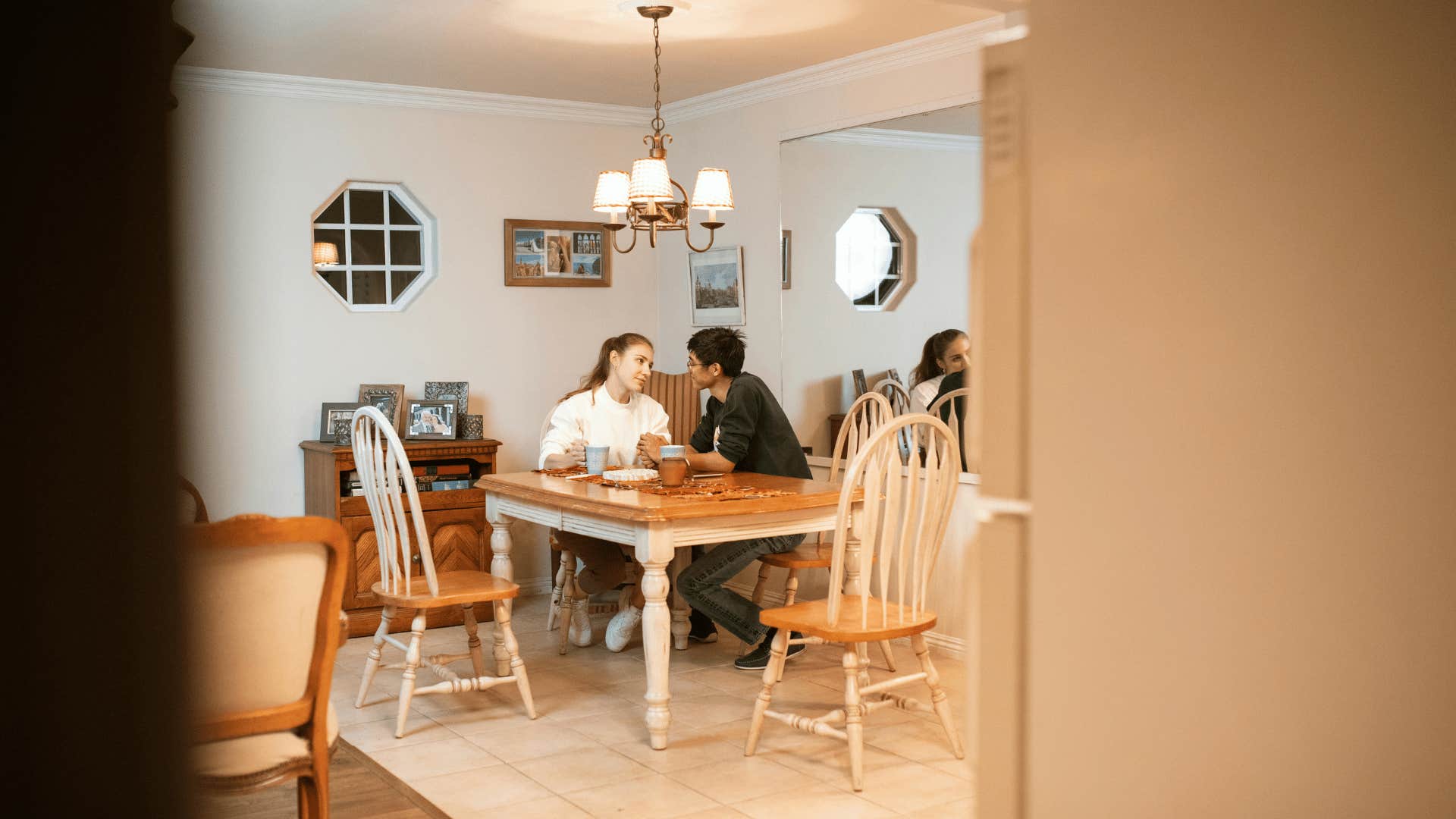 man and woman sitting at table