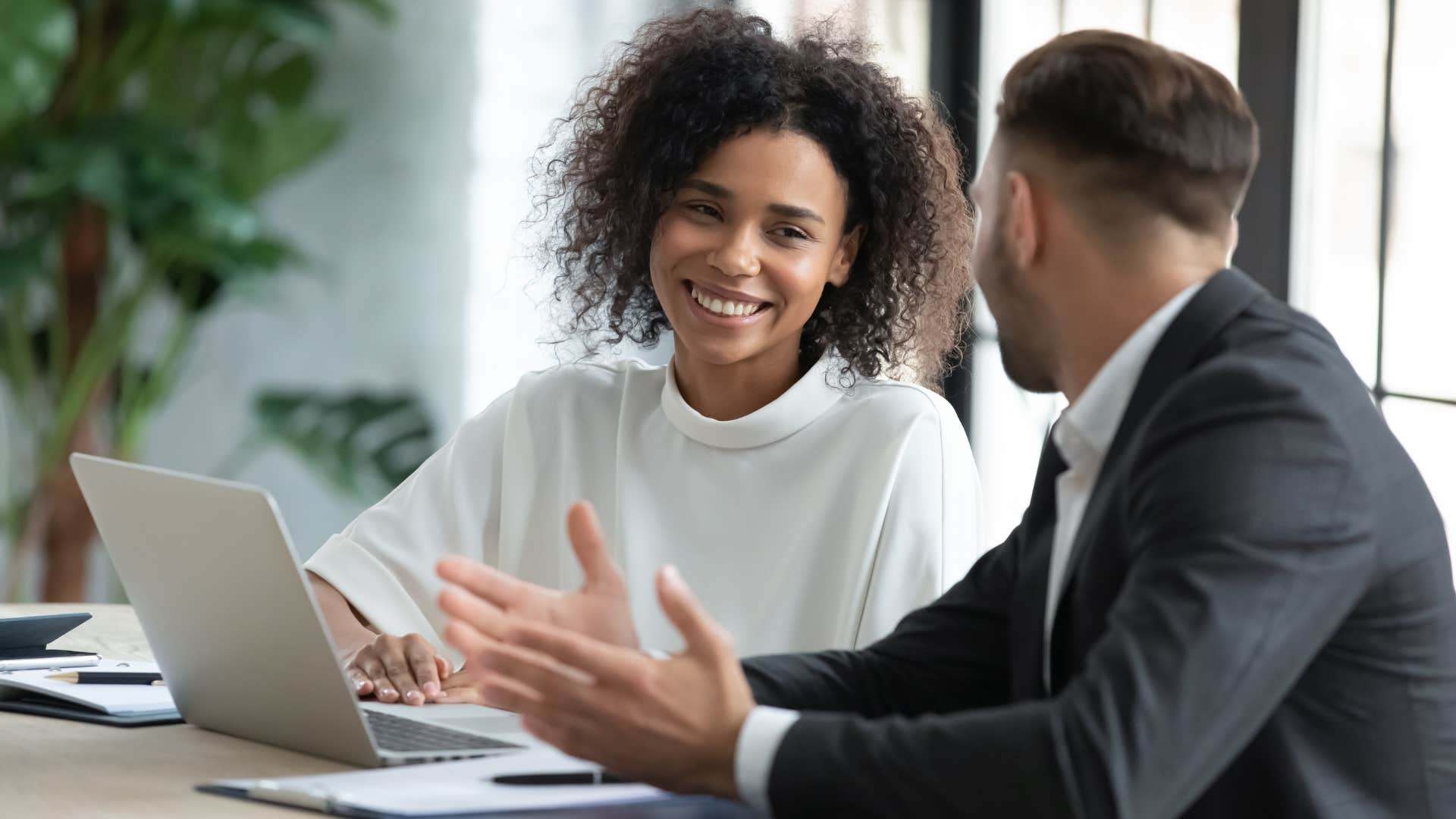 Man talking to a woman at work