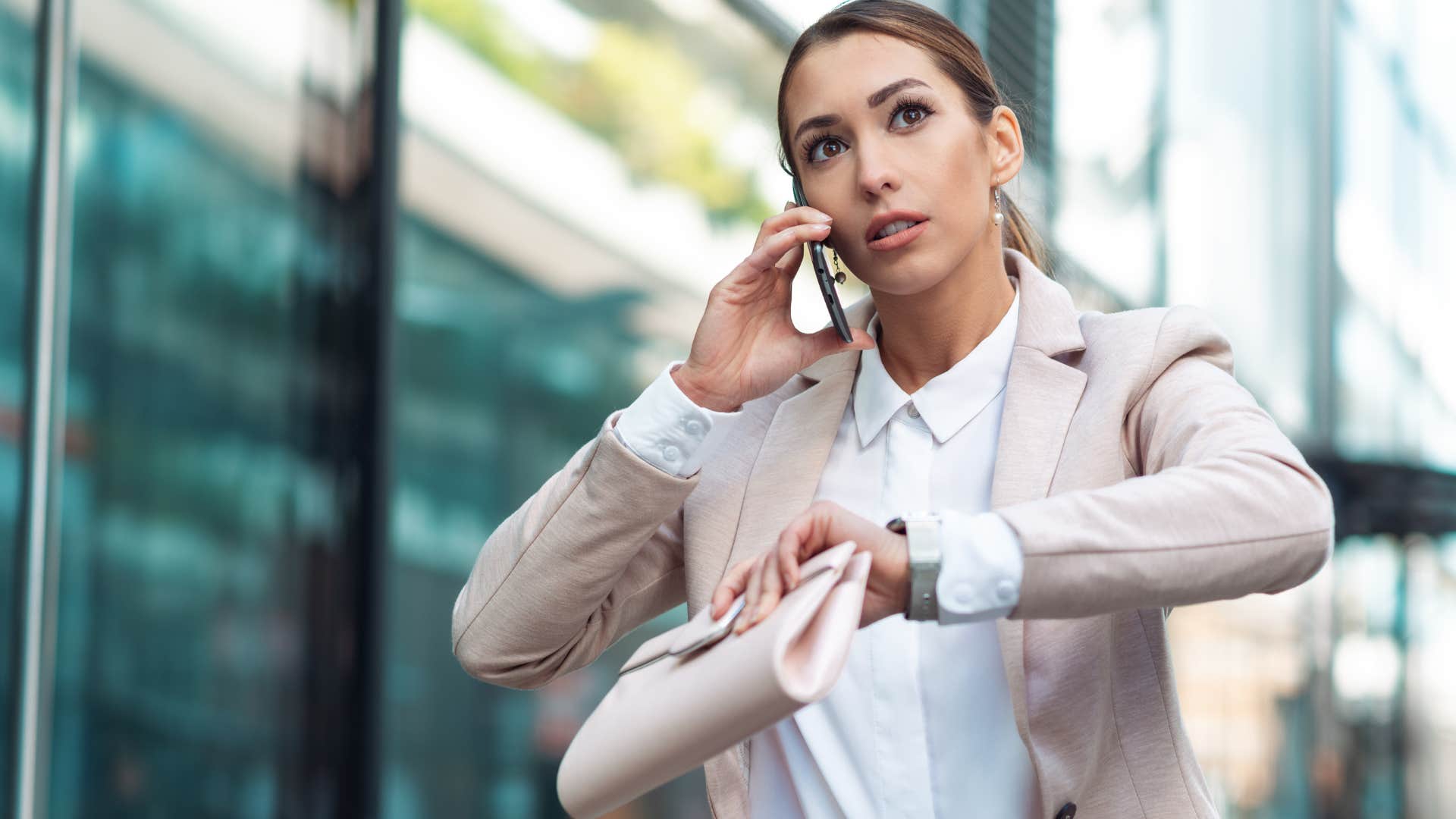 Woman talking on the phone while running late