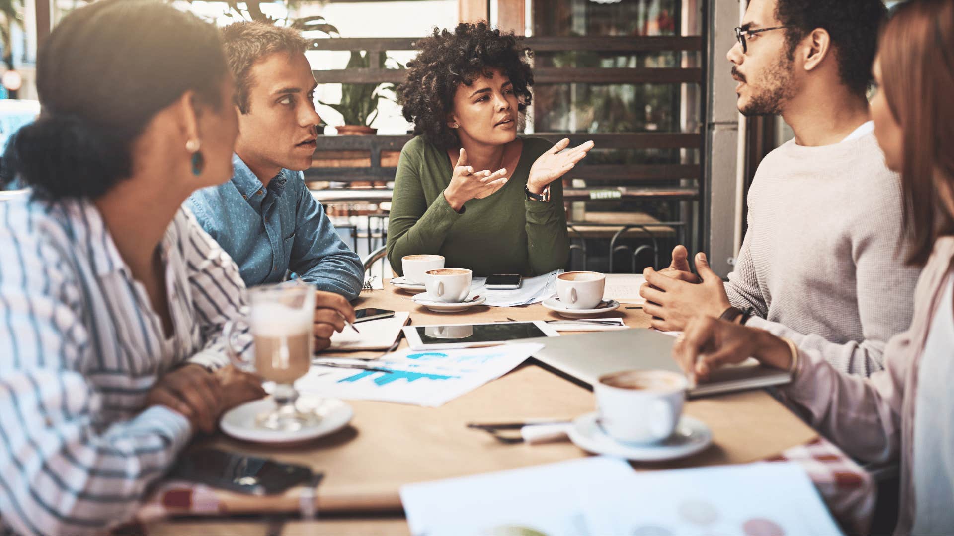 woman gesturing with hands during a meeting 