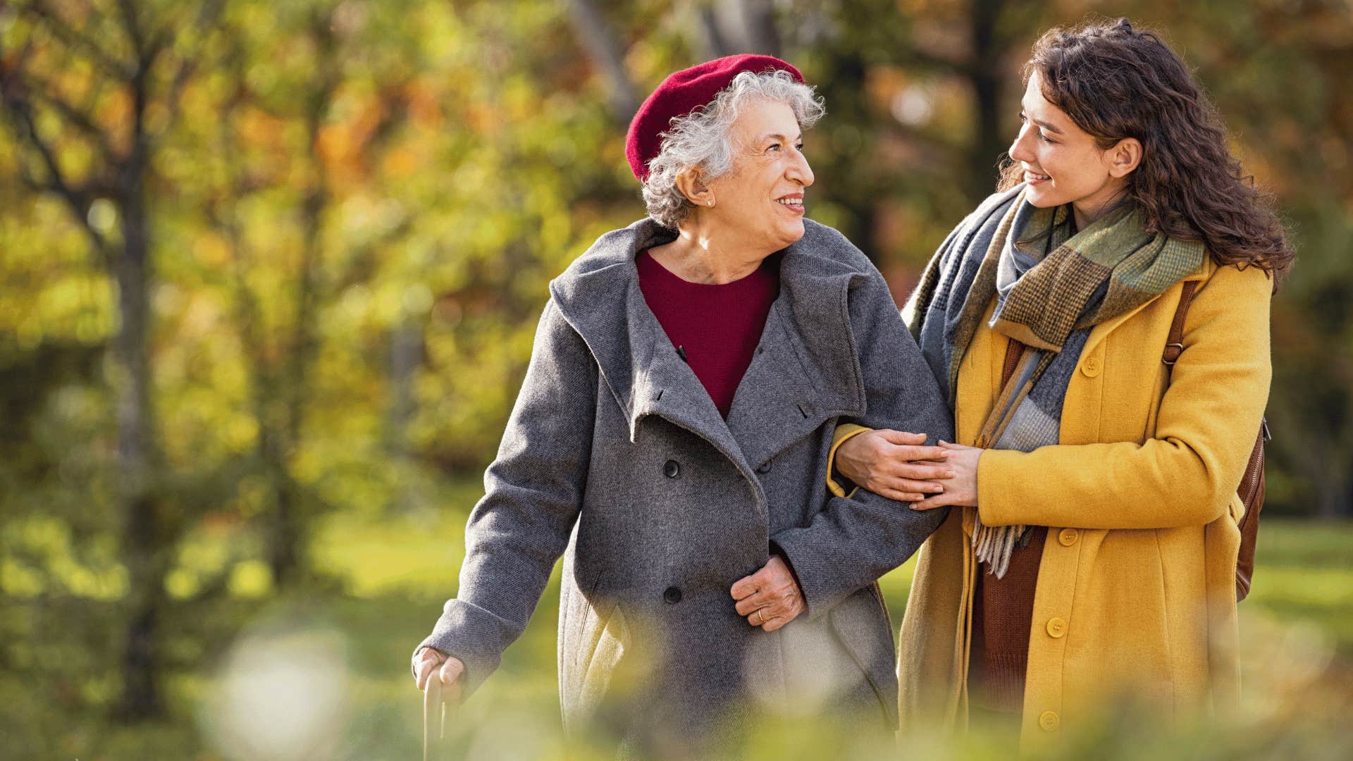 two women walking and looking at each other