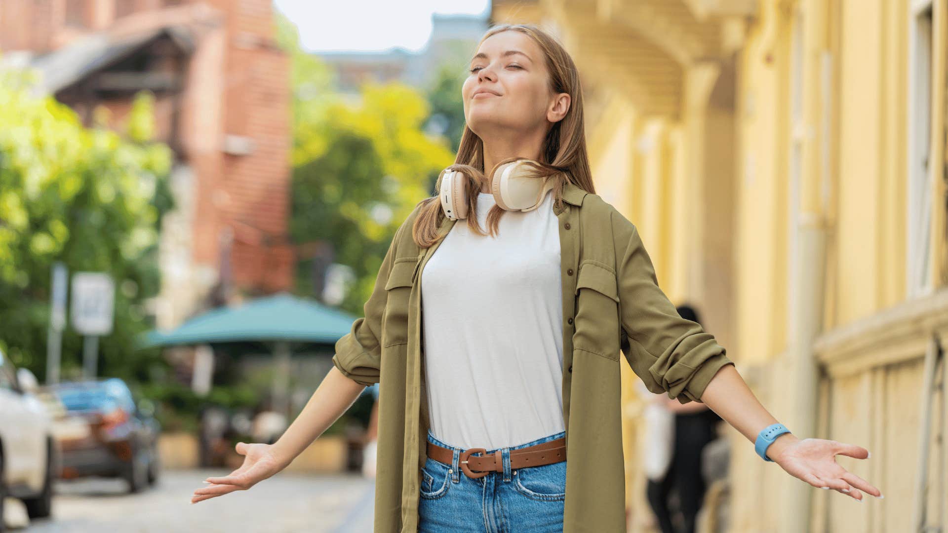 woman breathing in deeply outside 