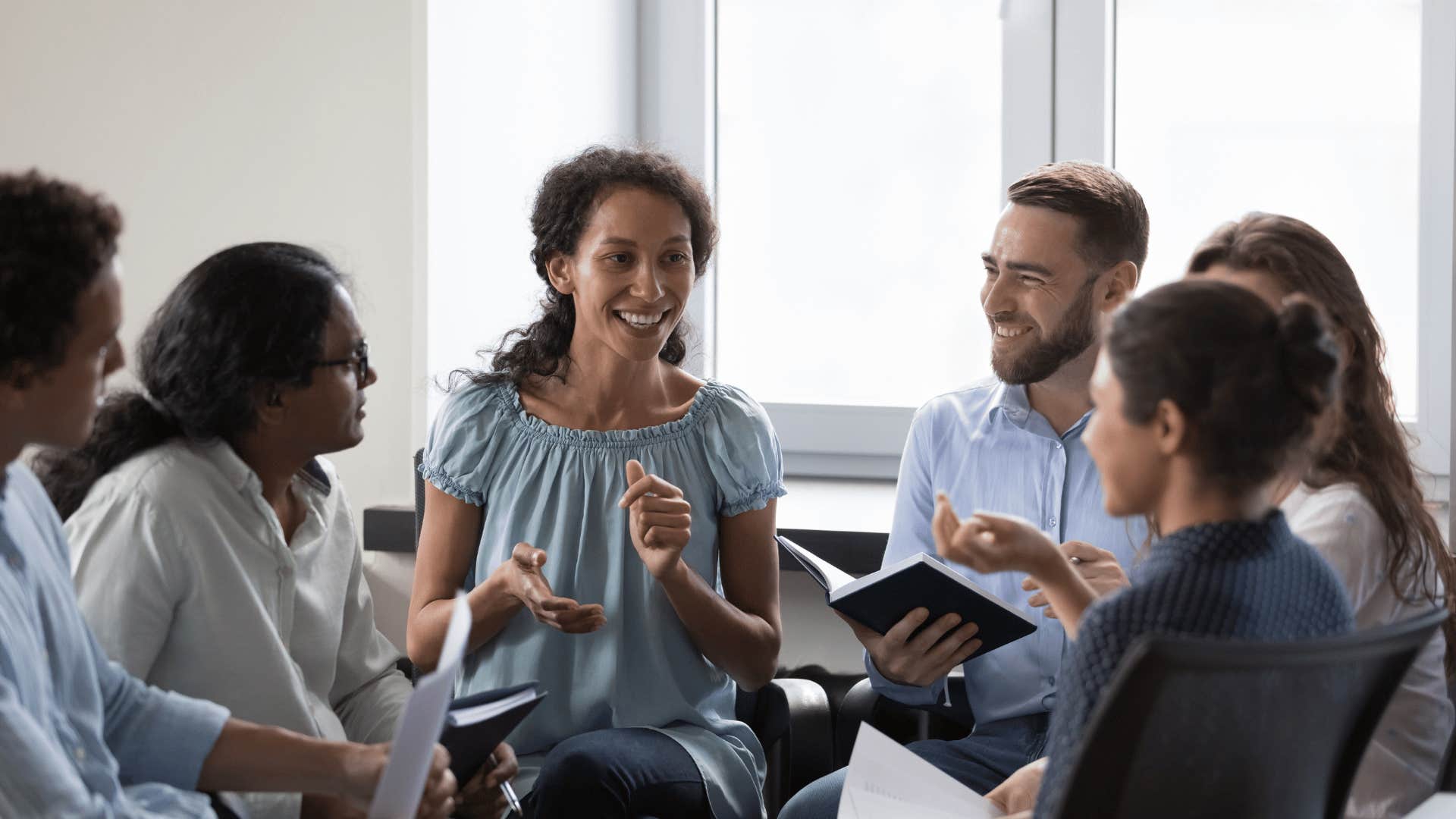 woman talking to a group of people