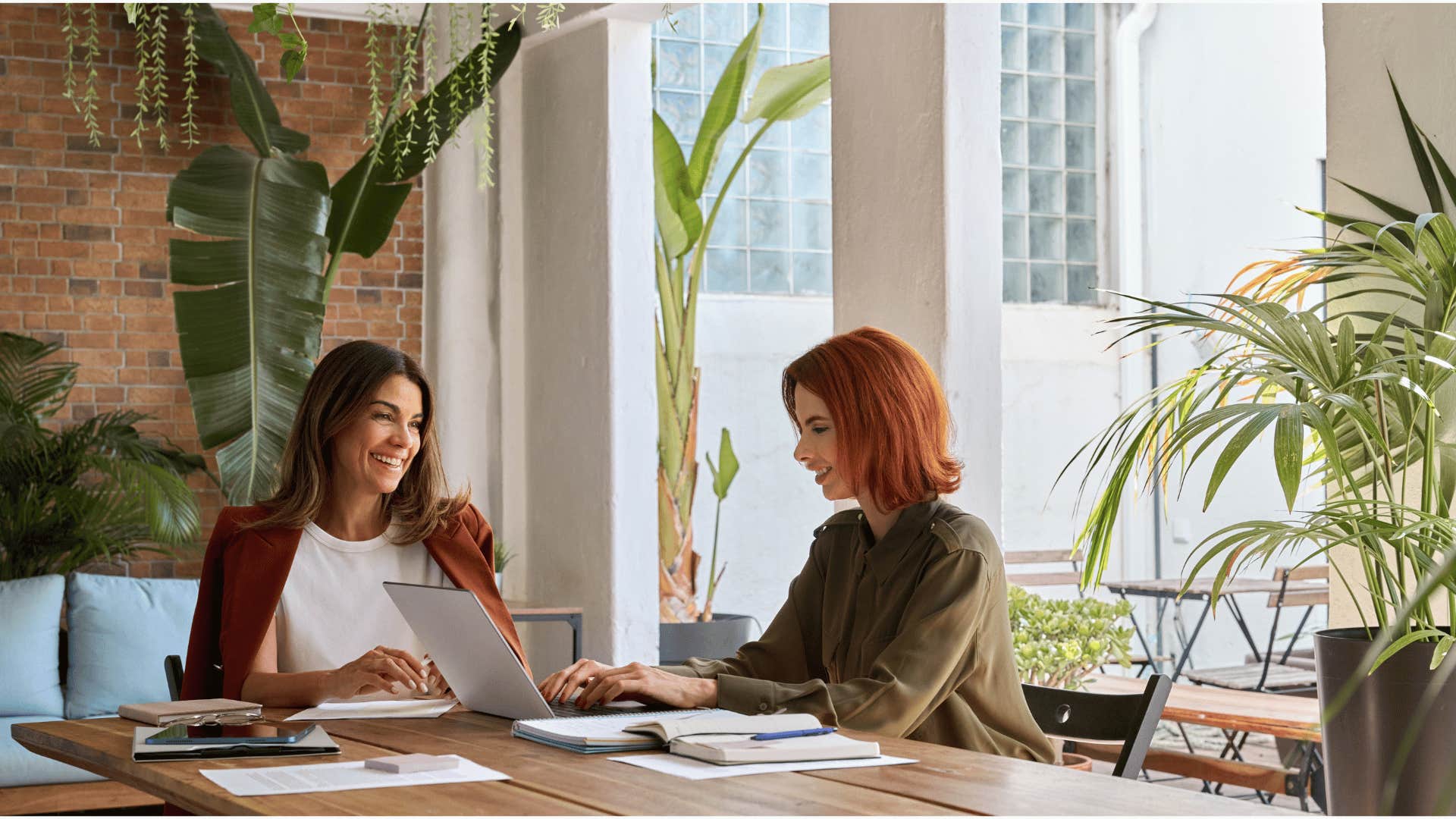 women sitting table talking