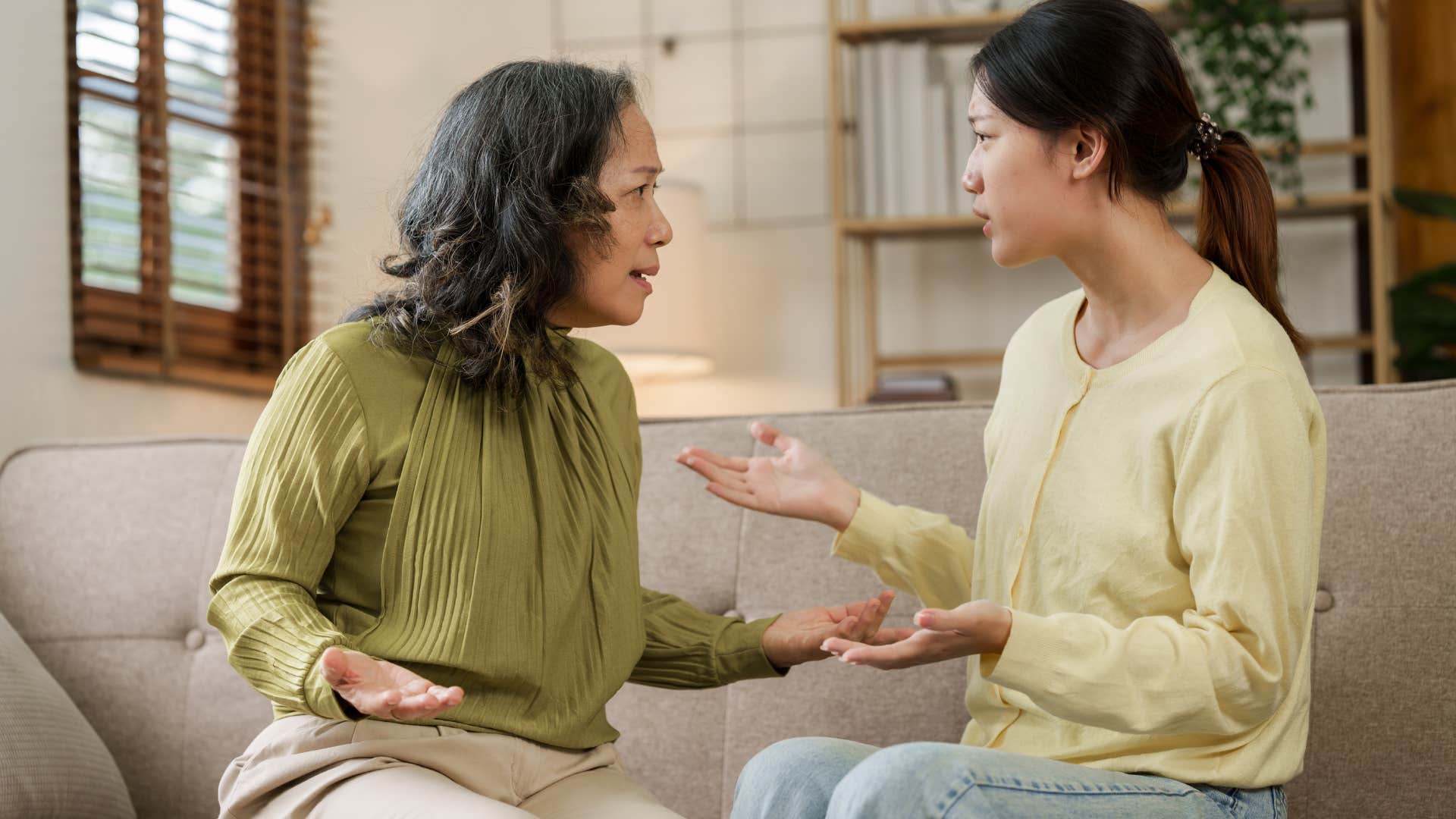 Woman arguing with her mom on the couch