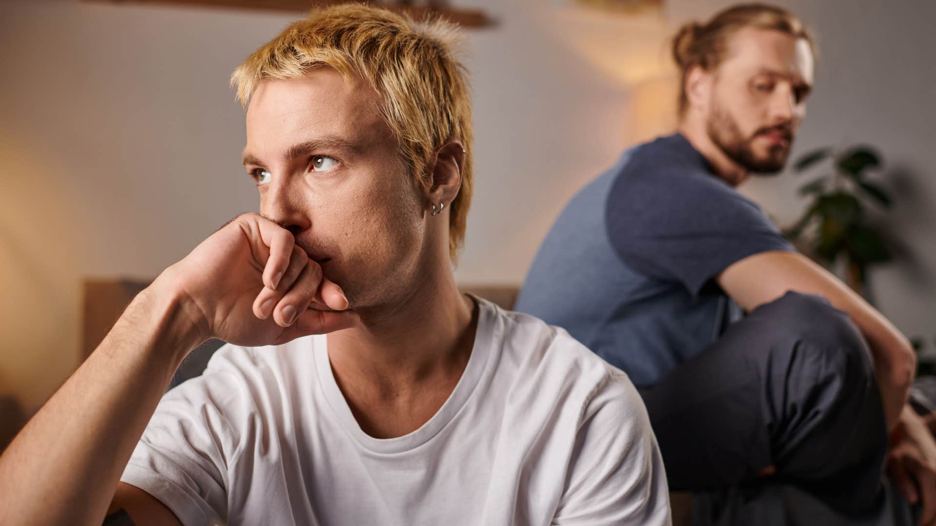 Upset man looking away from his partner