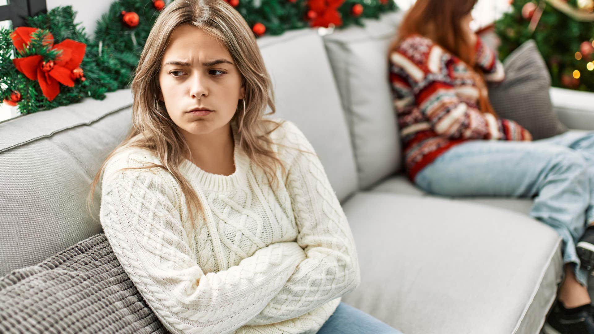 Young woman looking annoyed with her arms crossed