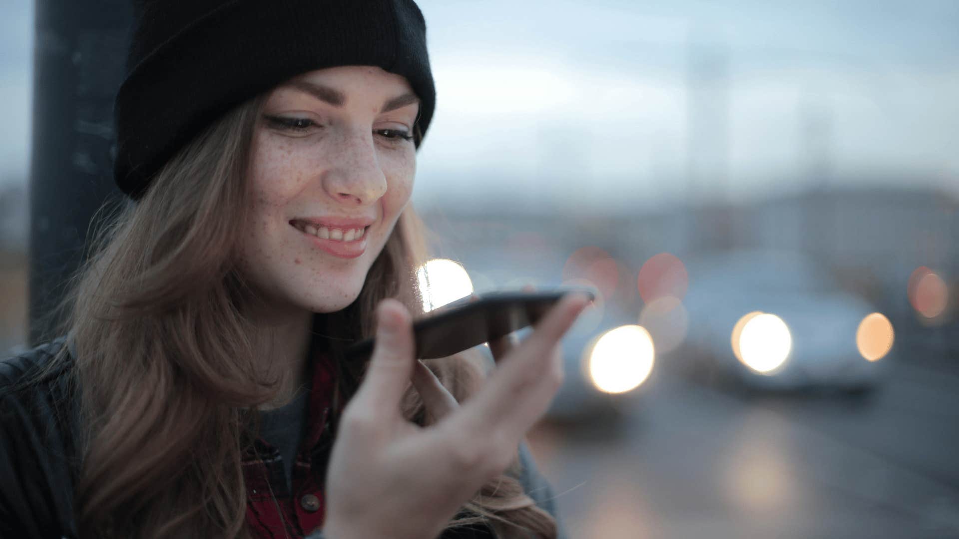 woman smiling on the phone