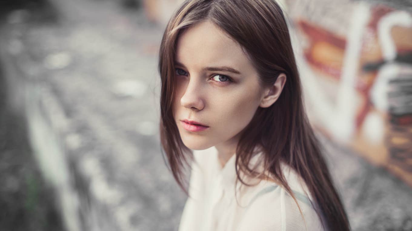 Upset adult woman looking directly at the camera.