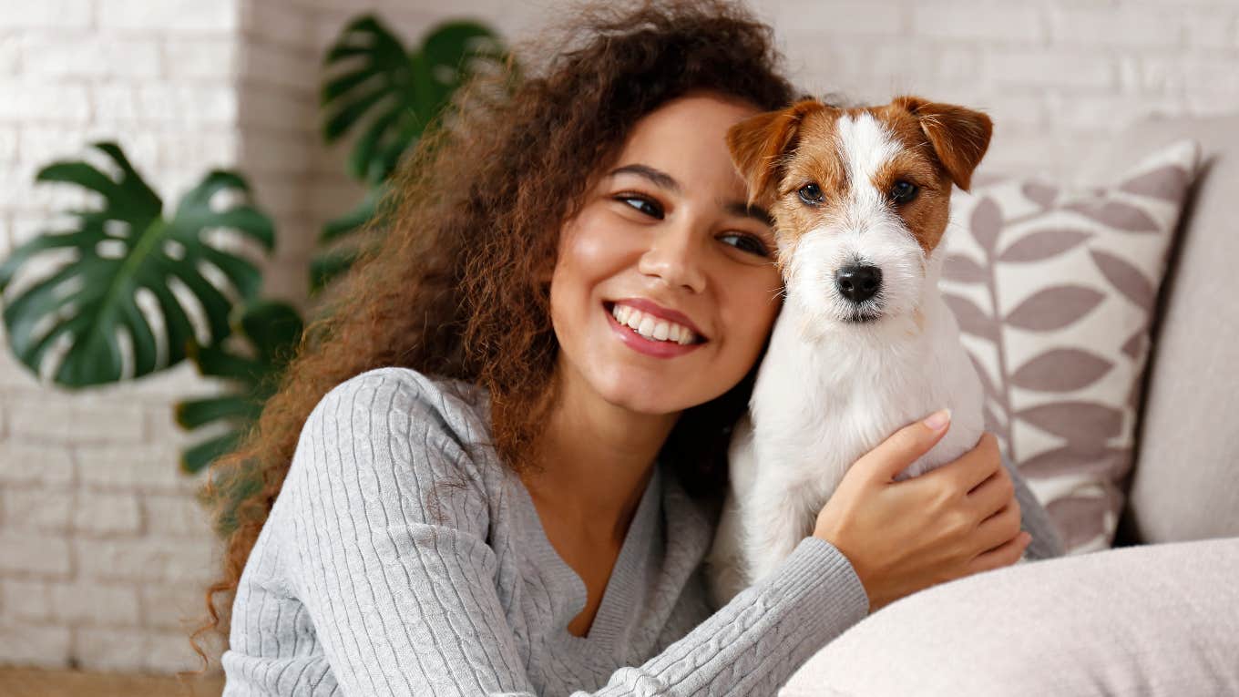 American pet owner hugging her dog