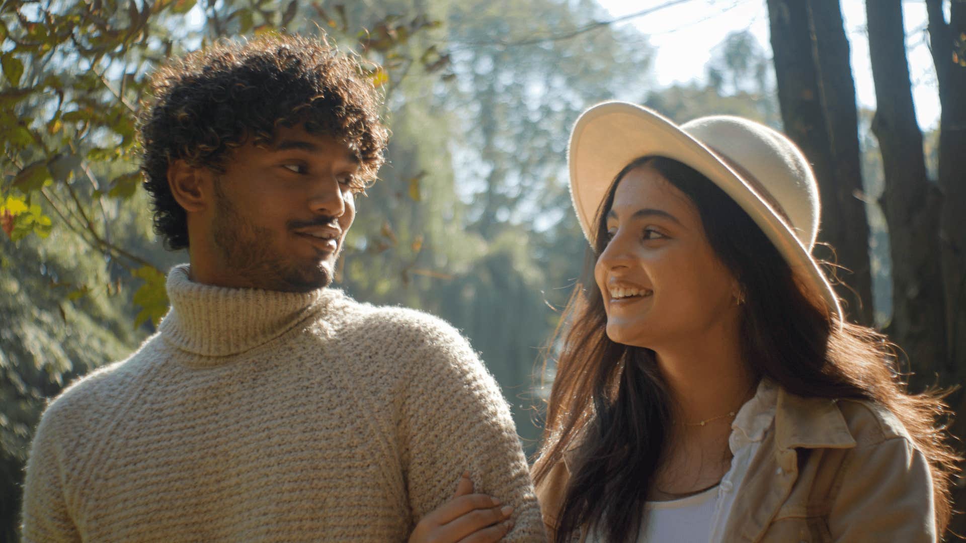 Couple takes time to talk while walking in park