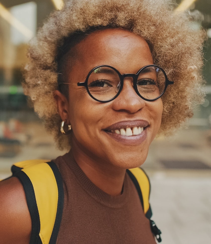 Smiling woman thinks positive