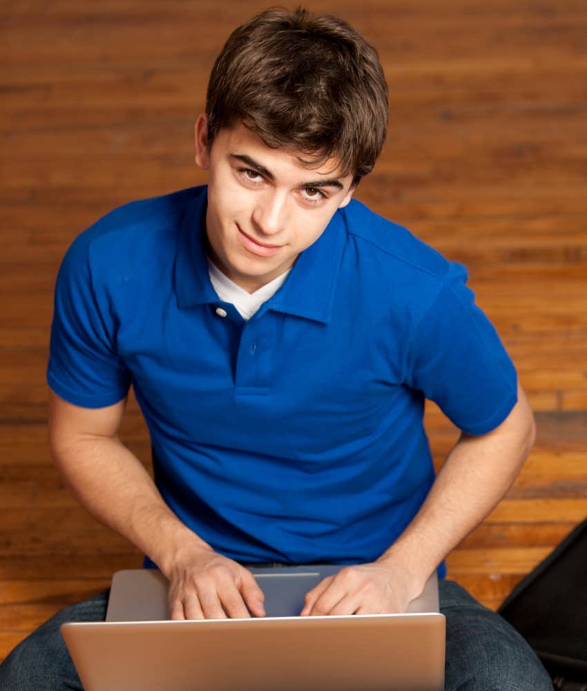 teen boy checking bank statement on computer