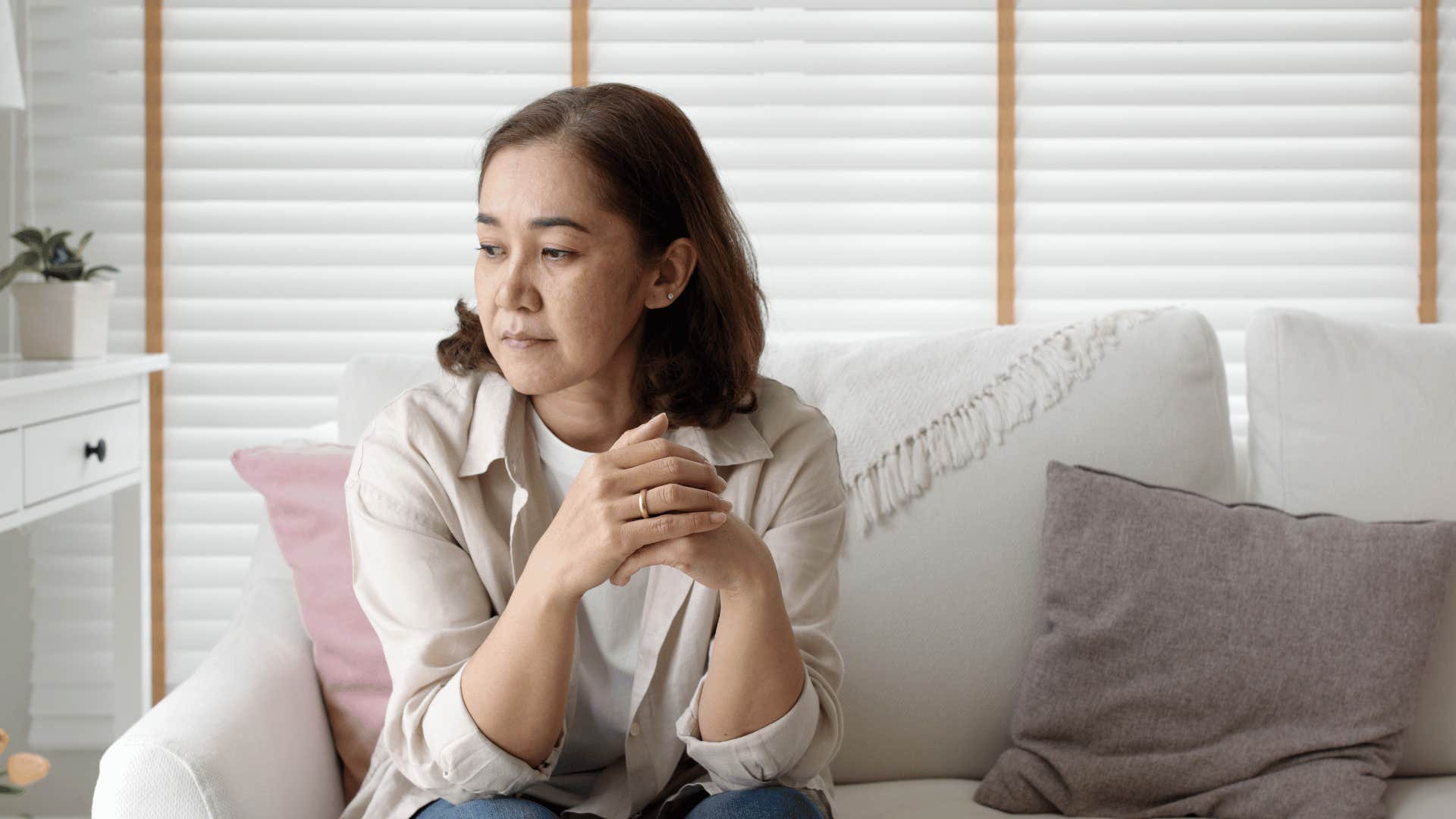 older woman sitting alone