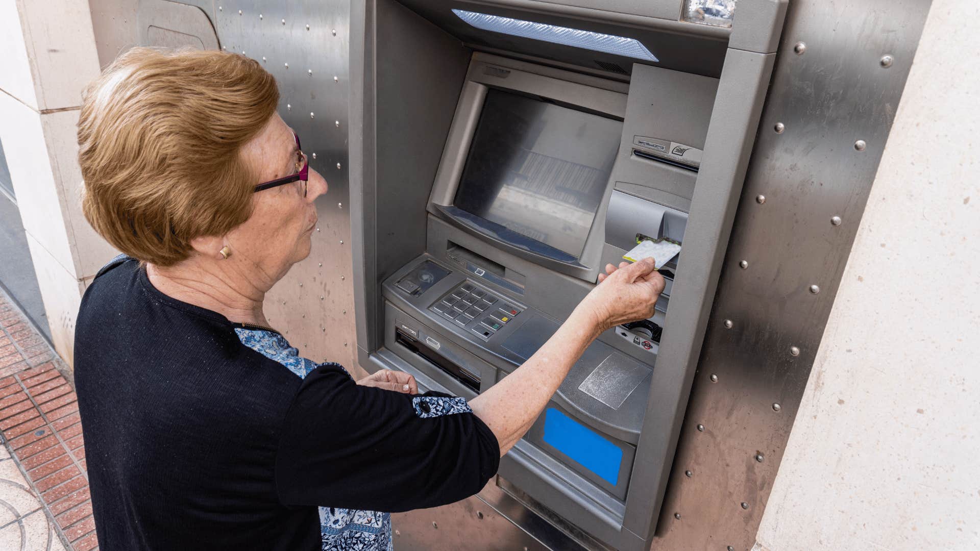 older woman at ATM