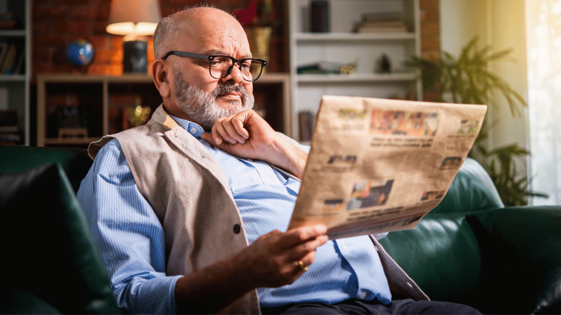 older man reading newpaper