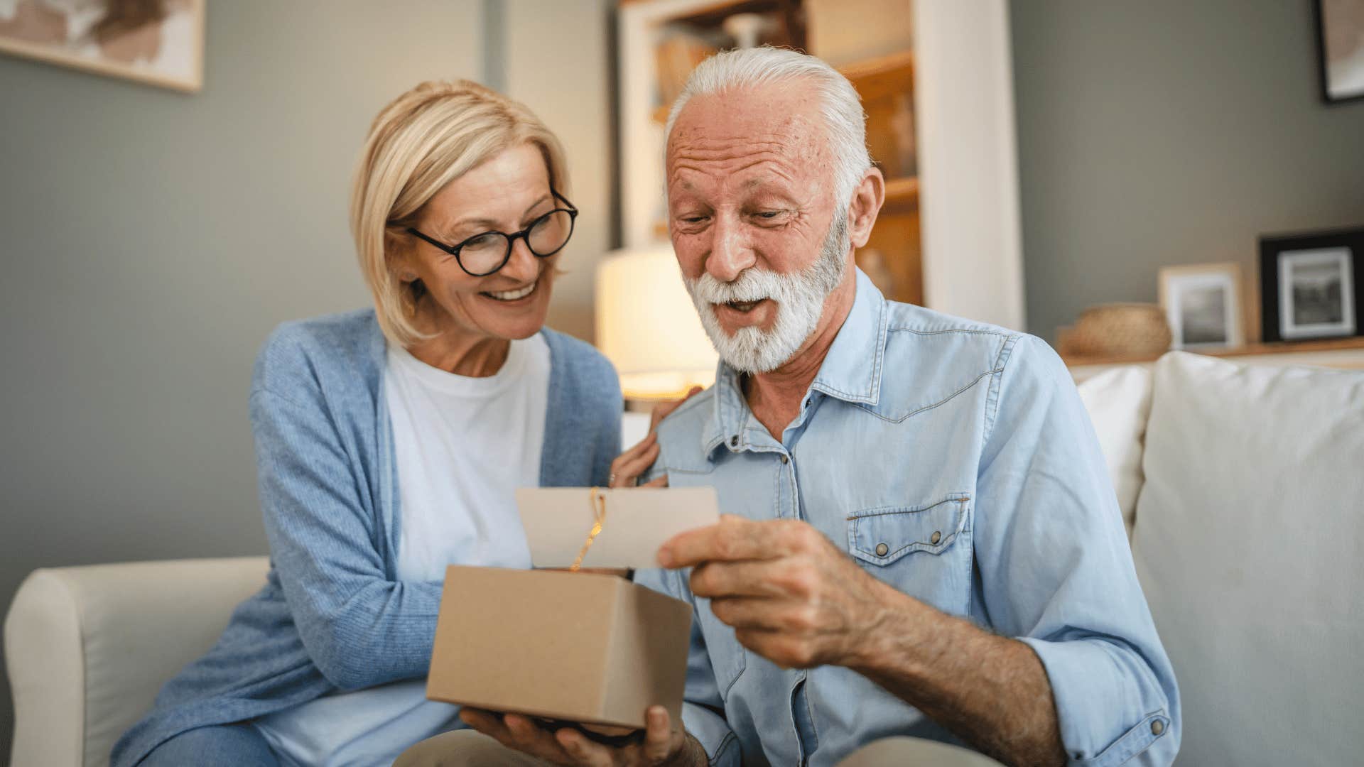 older man reading card 