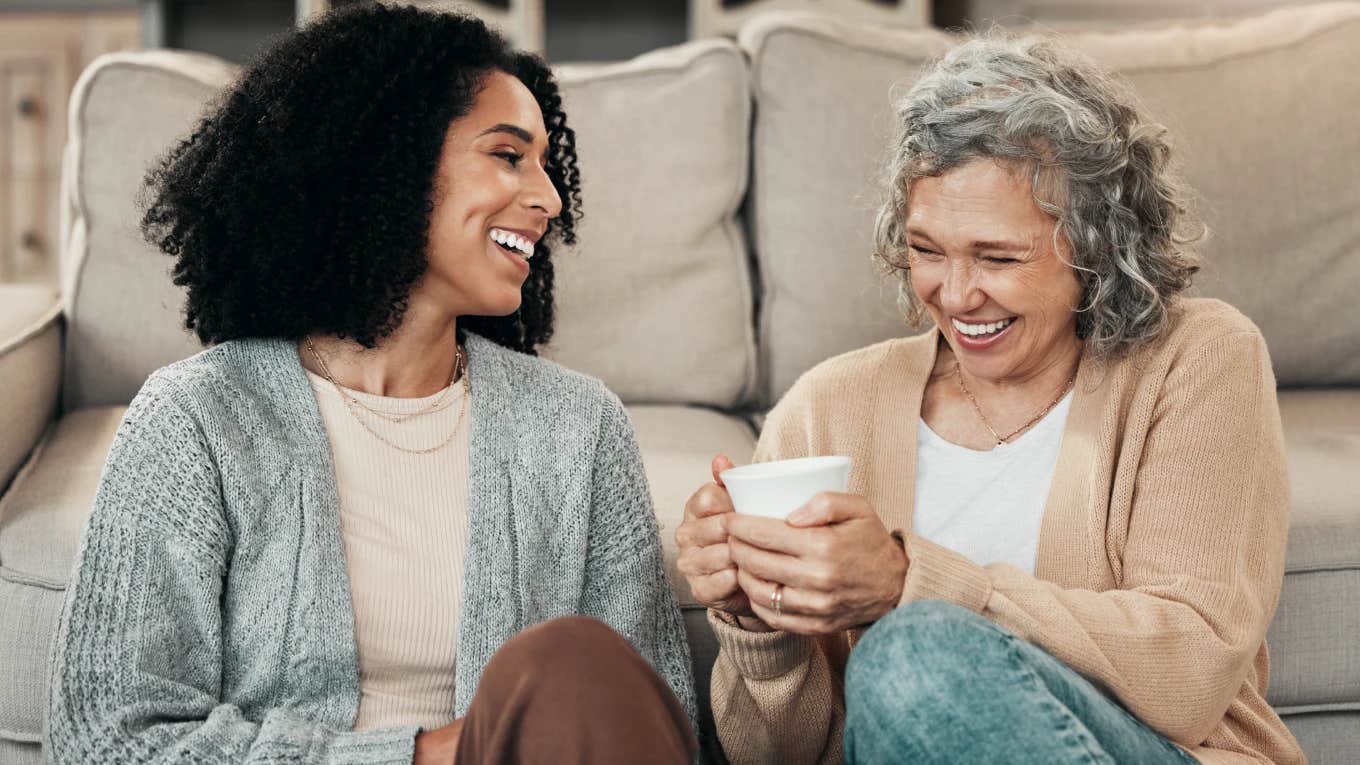 Happy adult child laughing with her mom