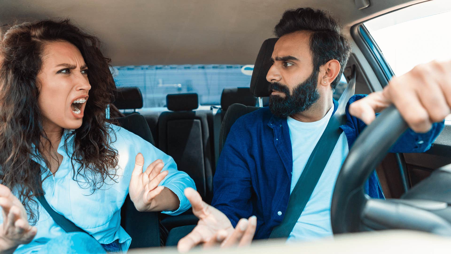 couple arguing in car