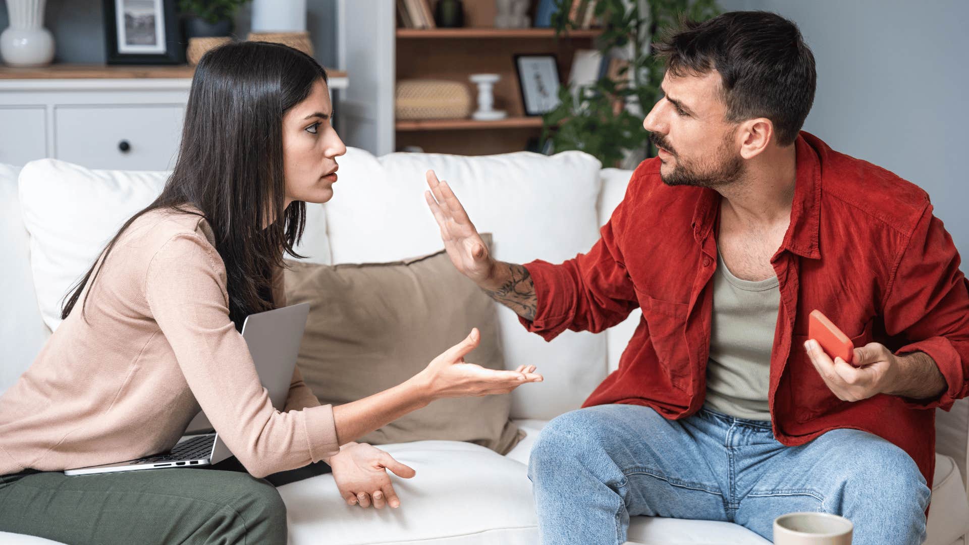 couple arguing on couch