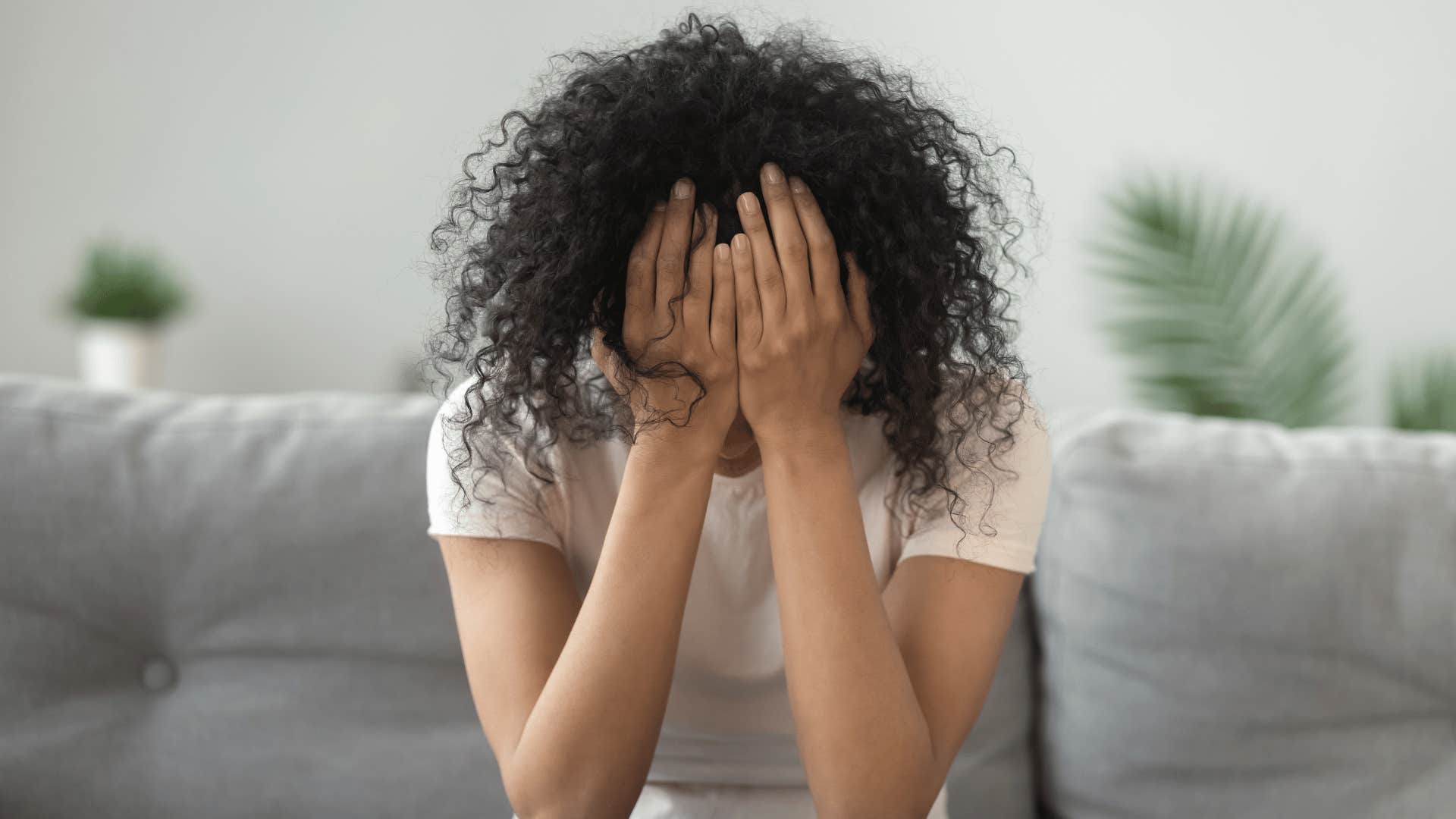 sad woman on couch