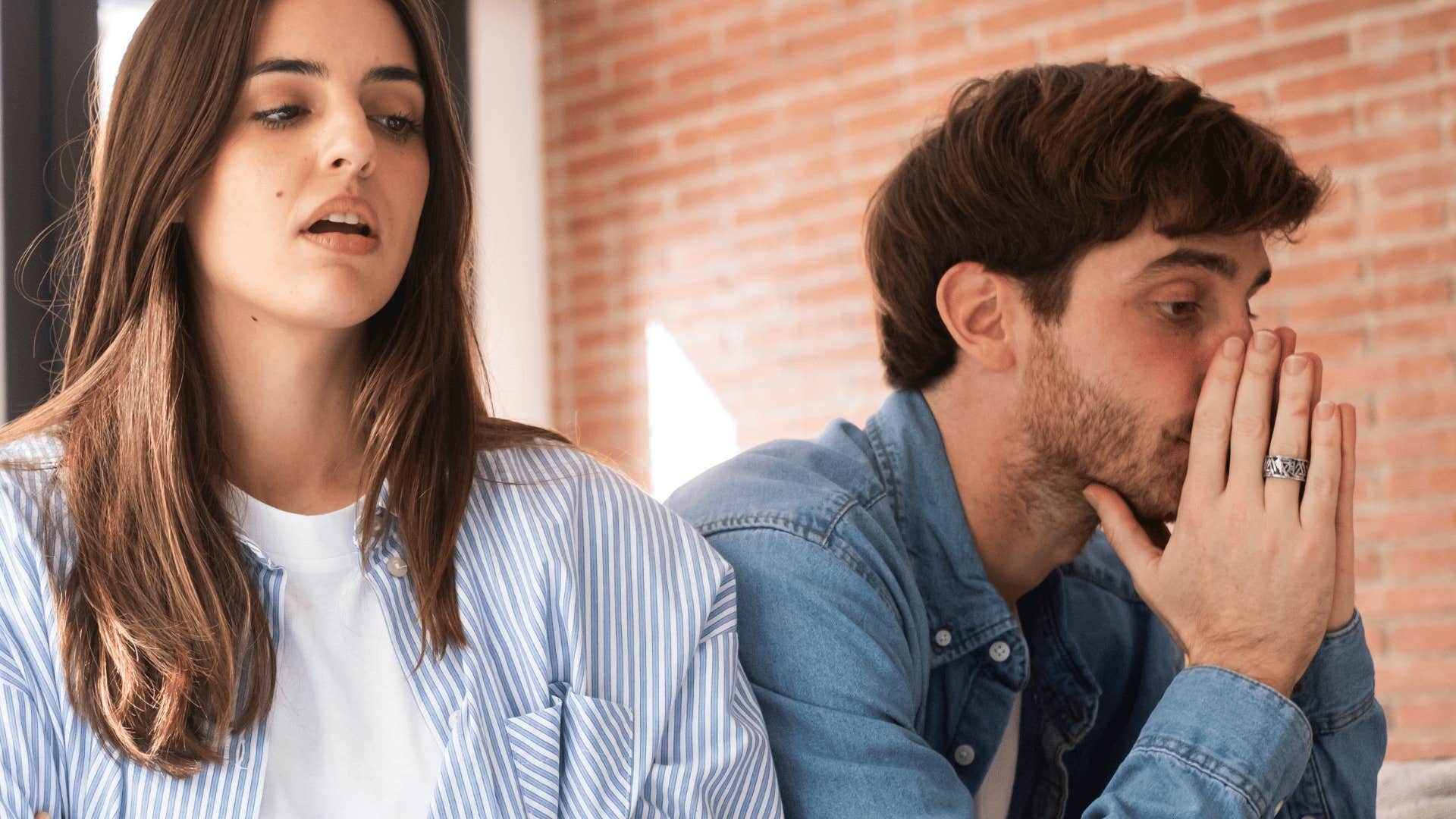 man ignoring woman talking