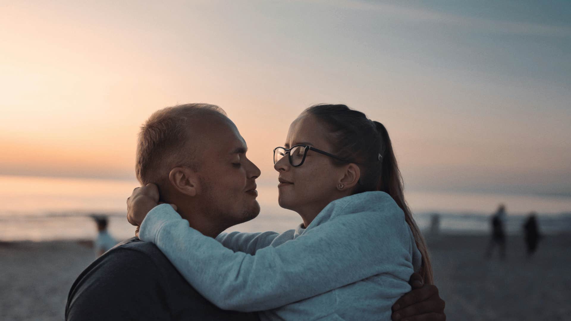 couple hugging on the beach