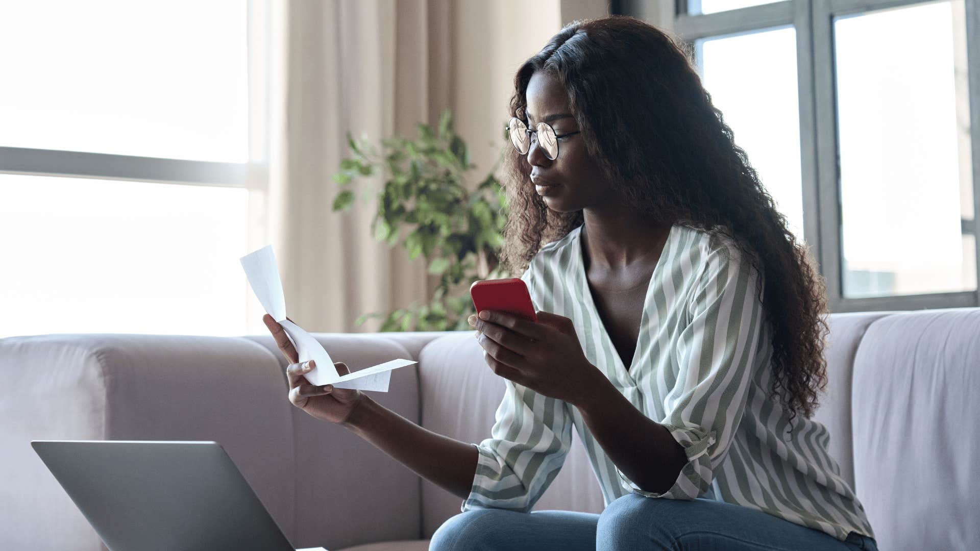 woman looking at finances 