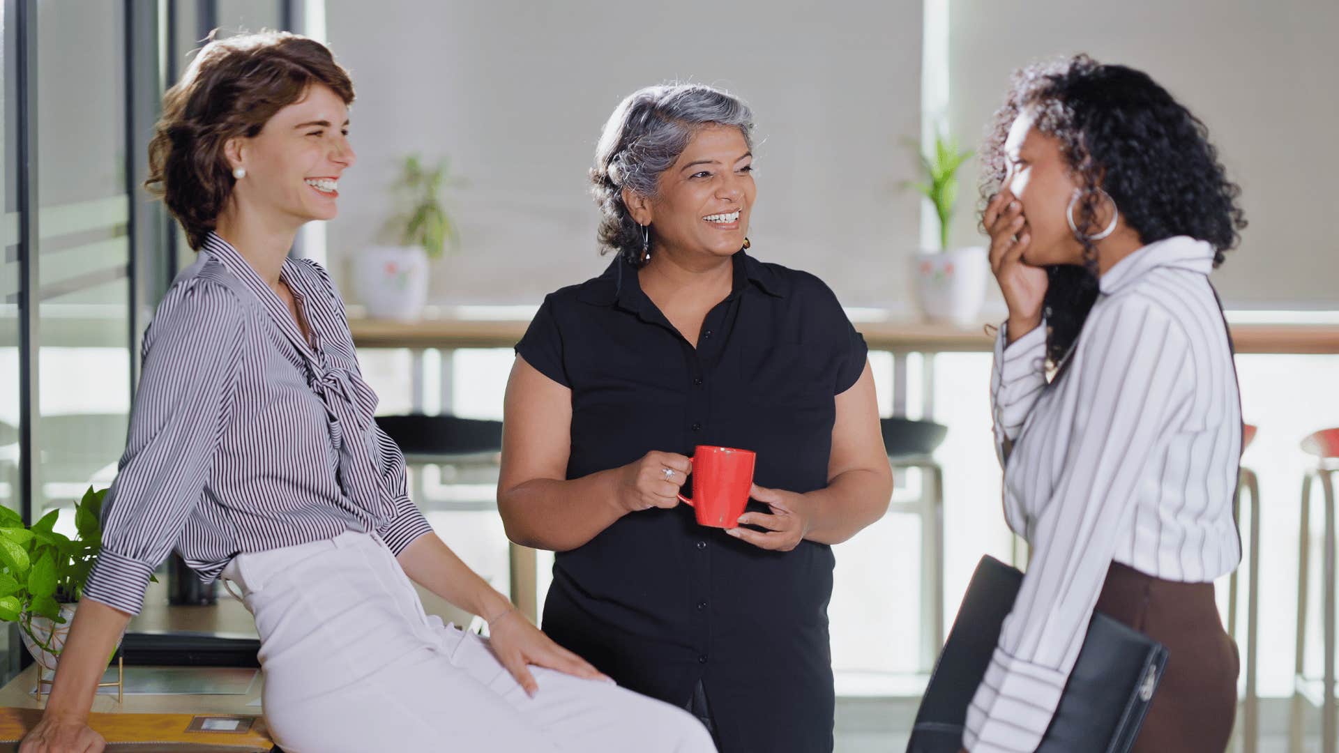 group of coworkers gossiping