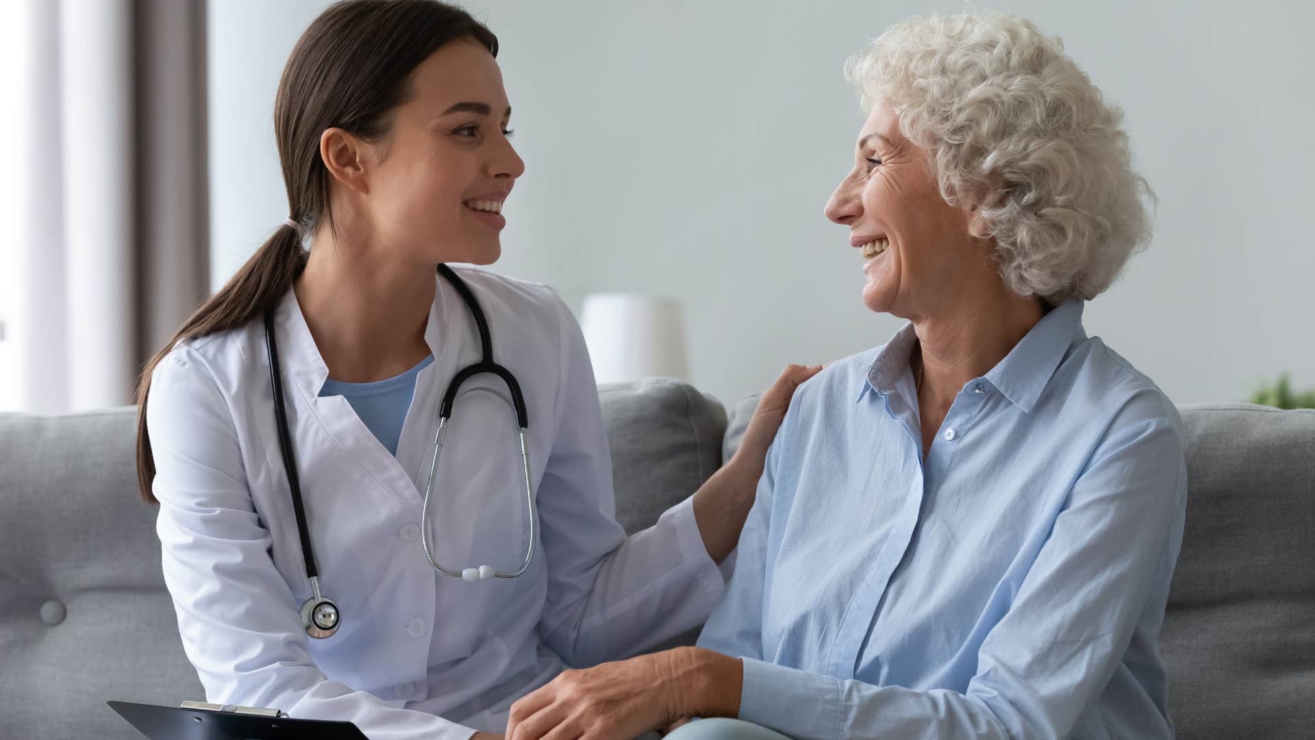 Woman talking to her smiling doctor