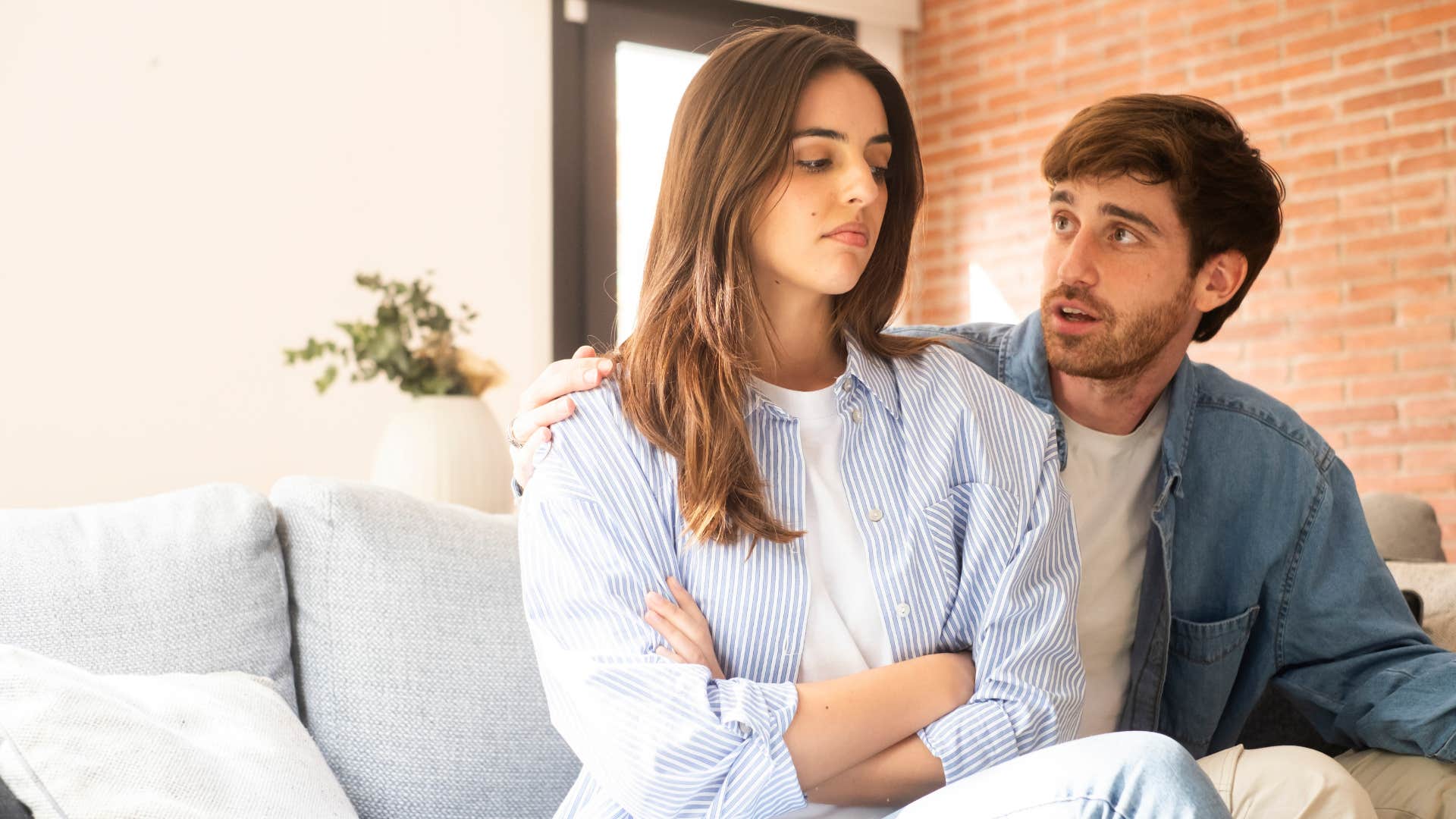 Woman looking defensive in front of her partner