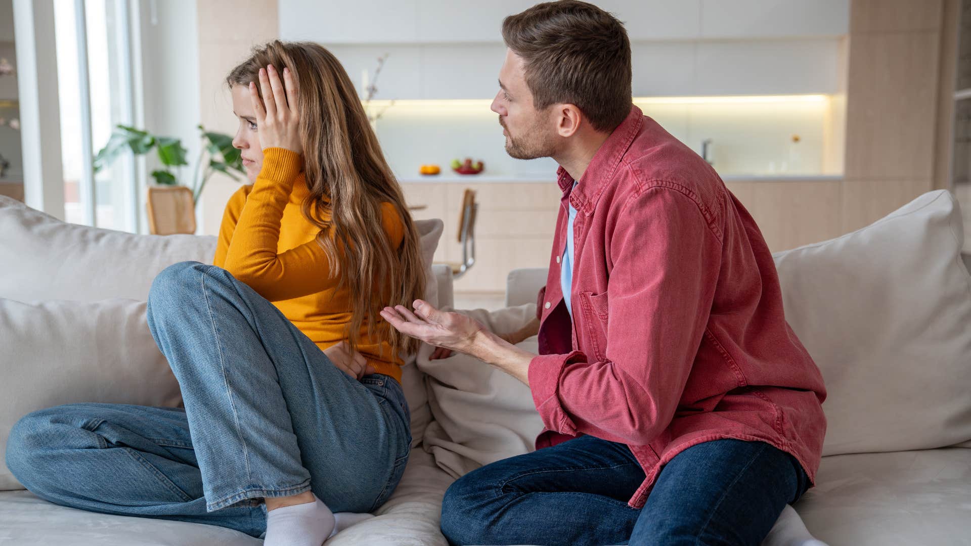 Man arguing with his partner turned away from him